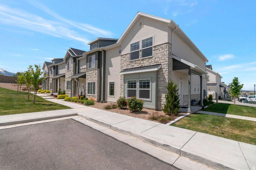 Come see it at an open house Saturday, June 20th from 11:00 to 1:00!! Seller willing to contribute to closing costs or interest rate buydown for strong offers.  Rare corner-lot townhome in Spanish Fork! Built in 2023 and in pristine condition. This beautiful home features its own front grass area and is steps from the community park, pavilion, and guest parking. Minutes from I-15 and major shopping. Microwave, fridge, dishwasher, washer/dryer, and garage storage shelves all included. Modern, well-kept, and move-in ready!