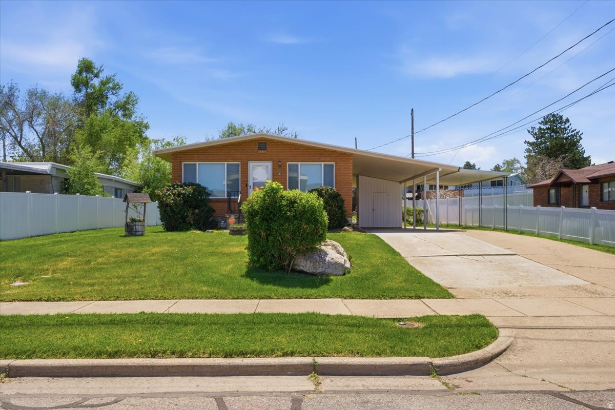 Charming Rambler in Washington Terrace! Very clean 4-bedroom, 2-bath home in an established neighborhood featuring paint and flooring updated approximately one year ago, along with an inviting floor plan. Main level offers 2 bedrooms and a full bath, including an extra-large bedroom with dual closets. Finished basement includes 2 additional bedrooms, a full bath, and extra living space. Cozy cast iron stove adds warmth and charm. Spacious yard with room to relax, garden, or entertain. Convenient location near schools, parks, and amenities.