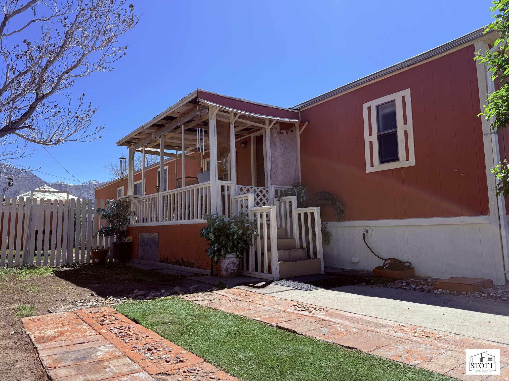 Open living/dining layout with functional kitchen and in-home laundry. Covered front porch for relaxing, private yard with space to enjoy, plus storage shed. Off-street parking and convenient access to shopping, dining, and main roads.