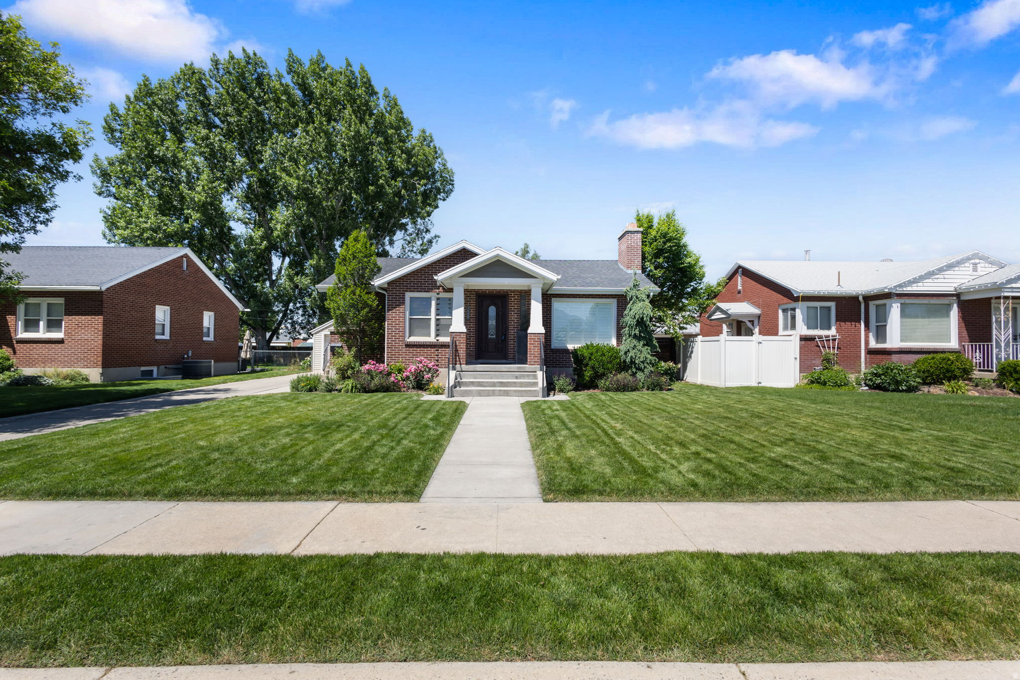 ***PRICE REDUCED*** Beautifully updated Midvale home offering 3,062 sq ft of thoughtfully designed living space with stunning east-facing mountain views. This spacious home features a vaulted family room filled with natural light, a fully finished basement, and a functional layout ideal for both everyday living and entertaining.    Enjoy year-round comfort with two furnaces allowing separate temperature control for each level, along with valuable upgrades including an on-demand water heater, water softener, exterior lighting, and even Jelly Fish lighting to keep your home lit up for each holiday. Cozy up inside next to the wood-burning fireplace or step outside to your fully fenced backyard featuring a large deck and built-in gas fireplace - perfect for entertaining or relaxing on summer evenings.  Conveniently located near shopping, dining, parks, and commuter routes, this centrally located home is just a 5-minute walk to UTA Trax, a 3 minute drive from I-15, and only 15 minutes from downtown. Offering comfort, convenience, and exceptional outdoor living, this home is one you won't want to miss.