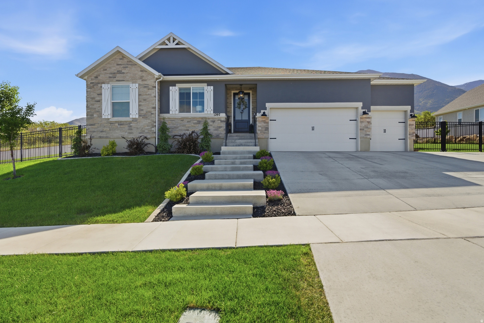 PRICE ADJUSTMENT, BEST HOME ON THE MARKET UNDER $1 MIL.  OPEN HOUSE THIS SATURDAY JUNE 6TH 10 AM - 12 PM. Better than brand new, this stunning home has been extensively upgraded with luxury finishes and thoughtful details and design throughout. The heart of the home features a completely redesigned custom kitchen with premium Wolf appliances, Cove dishwasher, Sub-Zero refrigerator, upgraded faucets, designer fixtures, and high-end craftsmanship that elevates the entire living experience. With spacious open living areas and breathtaking mountain views, this home offers both elegance and comfort in every detail.  Outside, the property is fully landscaped and includes a spacious 60 x 20 RV pad, making it as functional as it is beautiful. The professionally finished basement adds incredible versatility with two large bedrooms, each featuring its own private ensuite bathroom, along with a full second kitchen-perfect for guests, multigenerational living, or entertaining. Every improvement was made with the intention of this being a long-term dream home, and it shows in the quality, care, and attention to detail throughout. This is truly a turnkey property where you can simply move in and enjoy. Come see for yourself-this is one you do not want to miss.