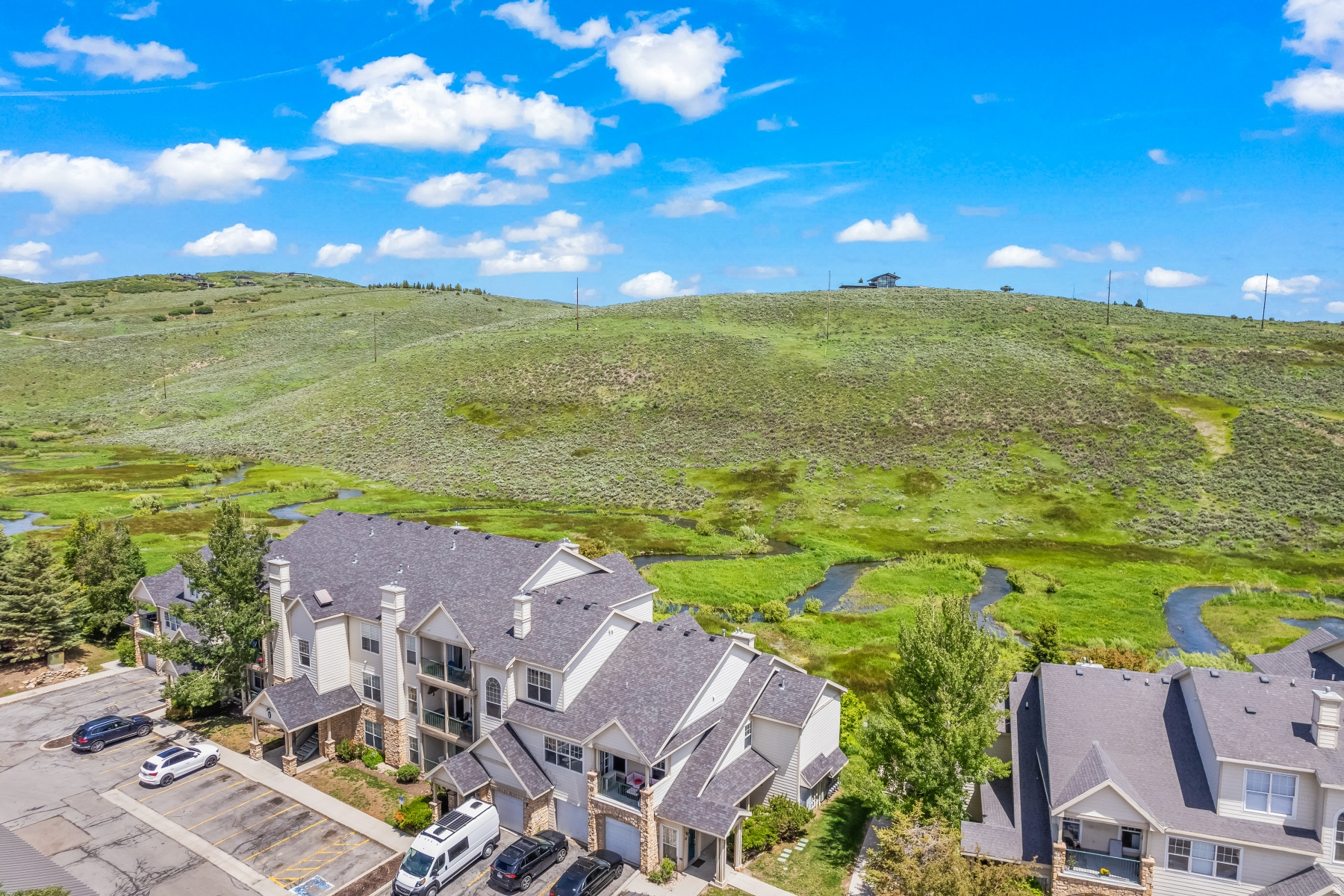 Turnkey Canyon Creek Condo with Stunning Preserve Views & Prime Park City Access  Experience the perfect blend of comfort, style, and convenience in this beautifully updated and fully furnished Canyon Creek condominium--nestled in one of the community's most private and sought-after locations. Backing to the peaceful preserve and creek, this exceptional residence offers a rare sense of serenity, surrounded by nature and abundant wildlife, while remaining just minutes from the heart of Park City. Tucked quietly at the rear of the development, this home enjoys a tranquil setting away from road noise, creating the ideal mountain retreat. Whether you're heading to the slopes, trails, shopping, or dining, everything is within easy reach--including quick access to I-80, Kimball Junction, Redstone, Park City Mountain, Deer Valley Resort, and the nearby Glenwild trail system. An on-site bus stop adds even more convenience for year-round adventure and commuting. Inside, the thoughtfully refreshed interior showcases stylish modern upgrades throughout. The kitchen features updated countertops, backsplash, appliances, hardware, and refinished cabinetry, while both bathrooms have been enhanced with upgraded vanities and fixtures. Additional improvements include newer carpet, fresh interior paint, updated water heater, and washer/dryer--creating a truly move-in-ready experience. Offered fully furnished, this turnkey property is ideal as a primary residence, vacation getaway, or investment opportunity. A private one-car garage provides added storage and convenience rarely found at this price point. Canyon Creek's desirable amenities include a clubhouse, fitness center, pool, hot tub, and outdoor sports courts, all within a pet-friendly community allowing one dog or two cats per unit. Whether you're looking for a peaceful full-time residence or the perfect Park City escape, this beautifully updated condo offers effortless mountain living in an unbeatable location.