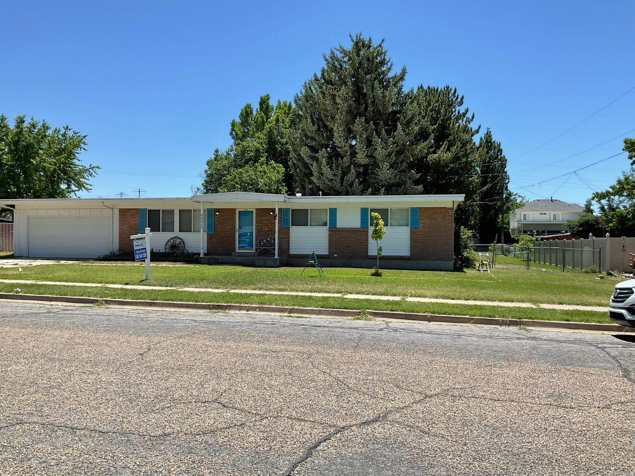 1 level living at its best. It sets on a 1/2-acre with beautiful grown shade trees. Cutest little red barn. Has a huge detached 2 car garage with a shop. If a person didn't want the workshop in the back of the garage it could be an easy 4 gar garage.
