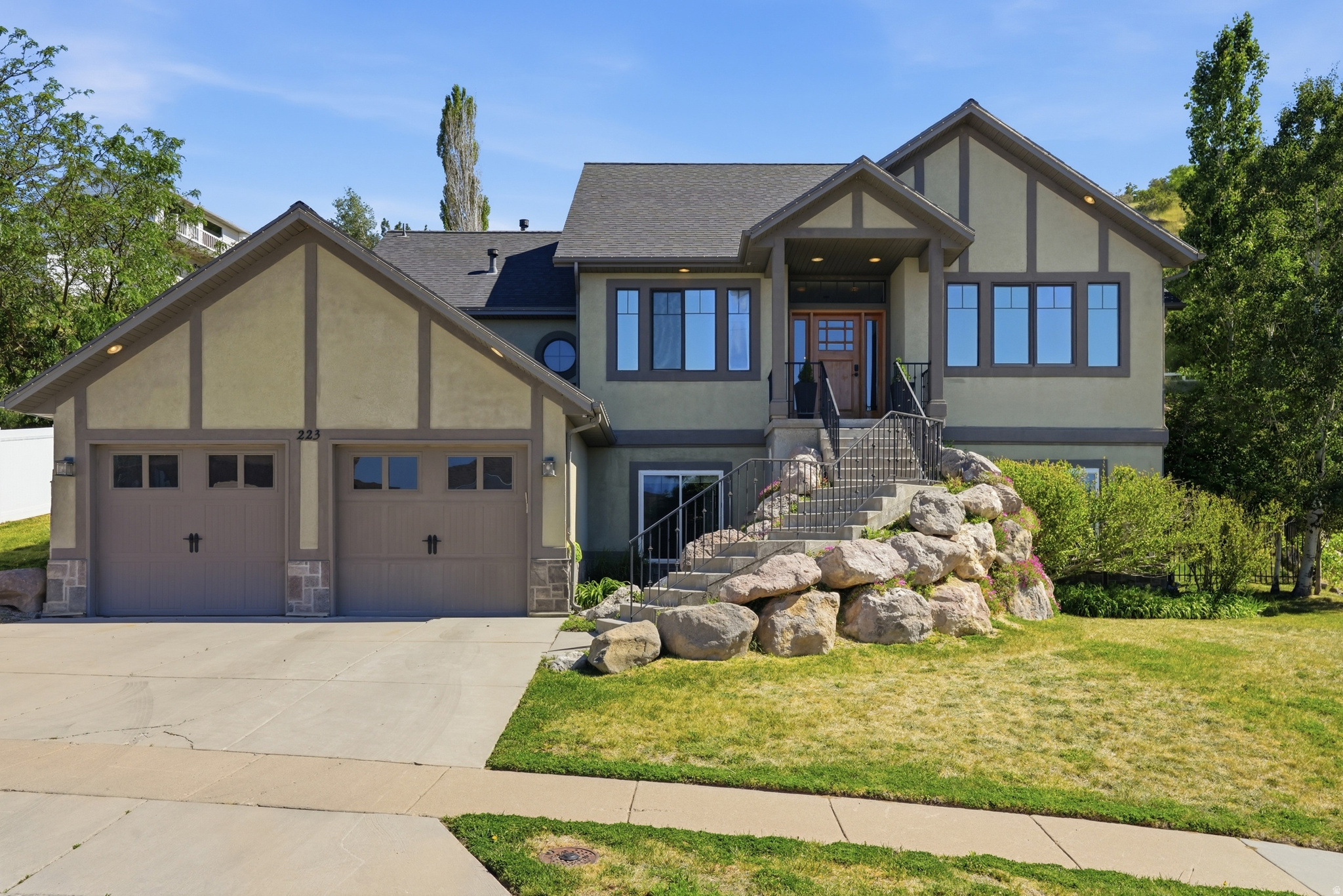 With sunrises in your backyard and the best sunset views from your front porch, life feels pretty good at 223 E 2050 N!    This gorgeous home is looking for its next family to make beautiful memories.   The views are outstanding here whether you're gazing out your backyard kitchen window to view the Wasatch mountains in your backyard,  enjoying the view from your primary bathroom or watching a sunset on the front porch. The views are unforgettable!  This home has been loved and the seller has done many upgrades so all you need to do is move in and enjoy!  Just a few include:  NEW HVAC System, NEW A/C condensers, NEW Smart Thermostats, NEW Everlights Permanent outside holiday lights, NEW Smart Door entry, NEW remodeled Primary bedroom (gorgeous), NEW Bespoke Refrigerator & Freezer, the list goes on!  You feel like you're far away from downtown Salt Lake City however close enough with your 20 minute commute. Oh and don't forget the 10 minute drive to the Farmington Station for great shopping and restaurants.  Come take a look and fall in love!!