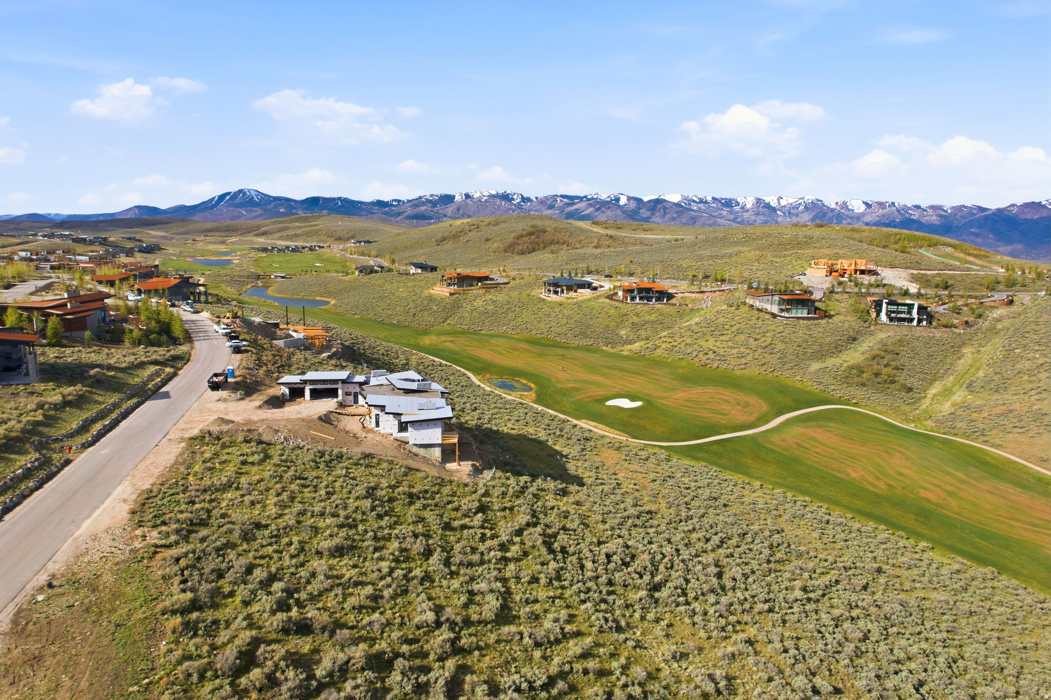 Promontory Homesite Above Nicklaus Course with Panoramic Golf & Mountain Views  Set above the Nicklaus Painted Valley Course in Promontory, this 0.74-acre homesite overlooks one of the community's most celebrated golf experiences. Designed by Jack Nicklaus, the course is known for its dramatic elevation changes, strategic bunkering, and sweeping Wasatch Mountain views. Fairways roll naturally through the terrain, creating a challenging yet playable layout that rewards precision while delivering a visually striking round from nearly every hole.  From this vantage point, enjoy front-row views of manicured greens framed by open sky and mountain ridgelines, with a sense of privacy that defines Promontory living. Spanning over 7,200 acres, the community offers a refined four-season lifestyle with world-class golf, dining, wellness, and family-focused amenities available through membership.  Just 20 minutes to Main Street, Park City, this homesite offers seamless access to acclaimed dining, culture, and ski experiences at Deer Valley. An exceptional opportunity to create a legacy residence within one of Park City's most iconic golf settings.
