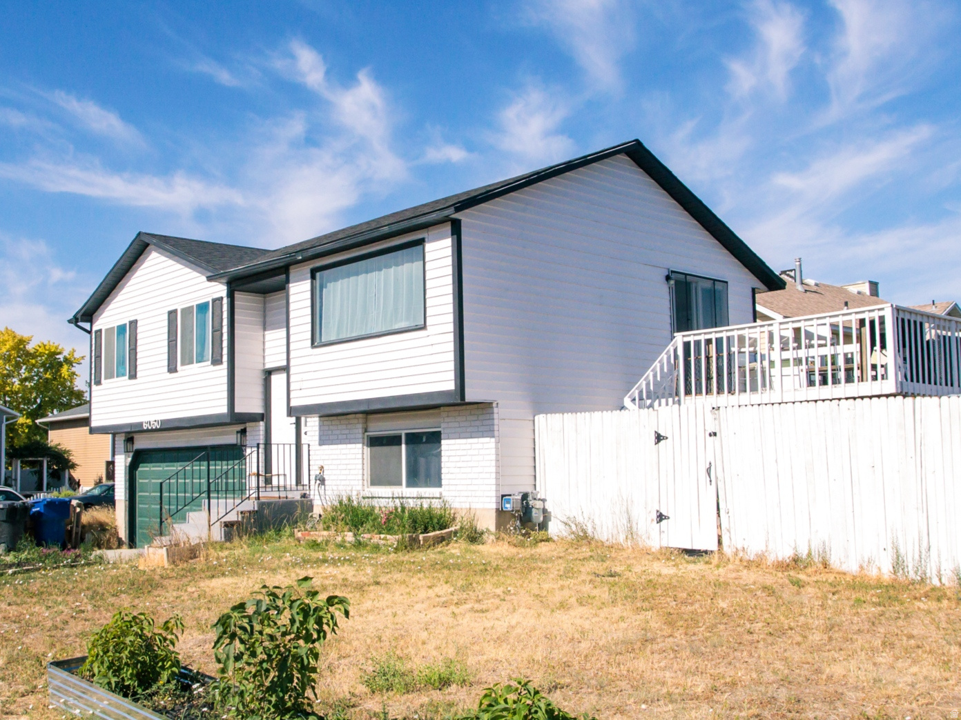 Beautifully updated home in quiet neighborhood.  Wonderful kitchen/living room area with vaulted ceiling and large kitchen island, opens up to a large deck overlooking the yard.  Large primary bedroom, updated bathrooms, two car garage.  Great neighborhood with easy freeway access.