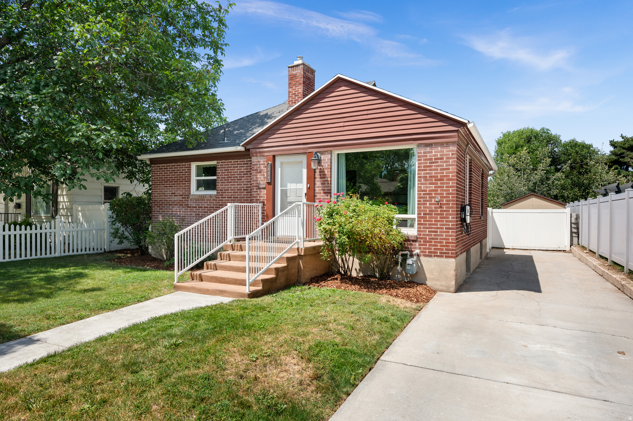 Cute red brick cottage located in a quiet Millcreek neighborhood! Several recent updates include a new roof 6 years ago, water heater is 5 years old, and a sleeve installed to the sewer line provides for future peace of mind. Main floor has prefinished hardwood and tile flooring and lots of natural light.  The lower level has tall ceilings, above grade windows, laminate floor throughout, and a laundry room with storage cabinets. Extra can lights have been added in the ceiling on both floors and there are updated vinyl windows. The backyard provides lots of space for entertaining in the patio that has an attractive pergola and outdoor lighting, storage shed and there's room for a garden area, and is fully fenced.  The driveway has room for several cars and has an EV charger attached.  A detached garage is possible. Ideal location close to Sugarhouse, Millcreek shopping and community events and close to the freeway, too!