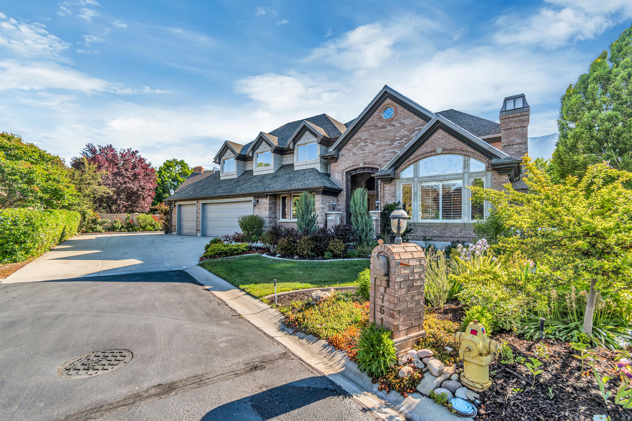 Discover the possibilities in this expansive 5,800+ sq. ft. custom home located in the highly desirable Scera Park South neighborhood. Showcasing breathtaking views of Mount Timpanogos, Y Mountain, Provo, and the surrounding valley, this property offers a rare combination of space, craftsmanship, and location. Thoughtfully designed with exceptional details throughout, the home features hand-carved wood finishes, artisan glass windows, steel and bronze railings, elegant marble and granite flooring, and a spacious living room highlighted by soaring 16-foot vaulted ceilings. With 7 bedrooms, 3 full baths, and 2 half baths, there is abundant room for family, guests, and flexible living spaces. Designed for both comfort and entertaining, this home includes a theater room, workout room, sauna, office/den, and a finished walkout basement complete with a kitchenette. The heated 3-car garage, double walk-in closets, high-end appliances, and recently updated heat pumps, furnaces, and water heaters add to the home's functionality and value. Situated on a generous 0.32-acre lot, the beautifully updated landscaping, newly refinished front and back walkways, and large covered patio with built-in BBQ completes an outdoor setting perfect for gatherings or relaxing while enjoying the scenery. Offering privacy with convenient access to local recreation, shopping, and amenities, this is a premier opportunity in a sought-after area. Buyer to verify all information. A must-see property!