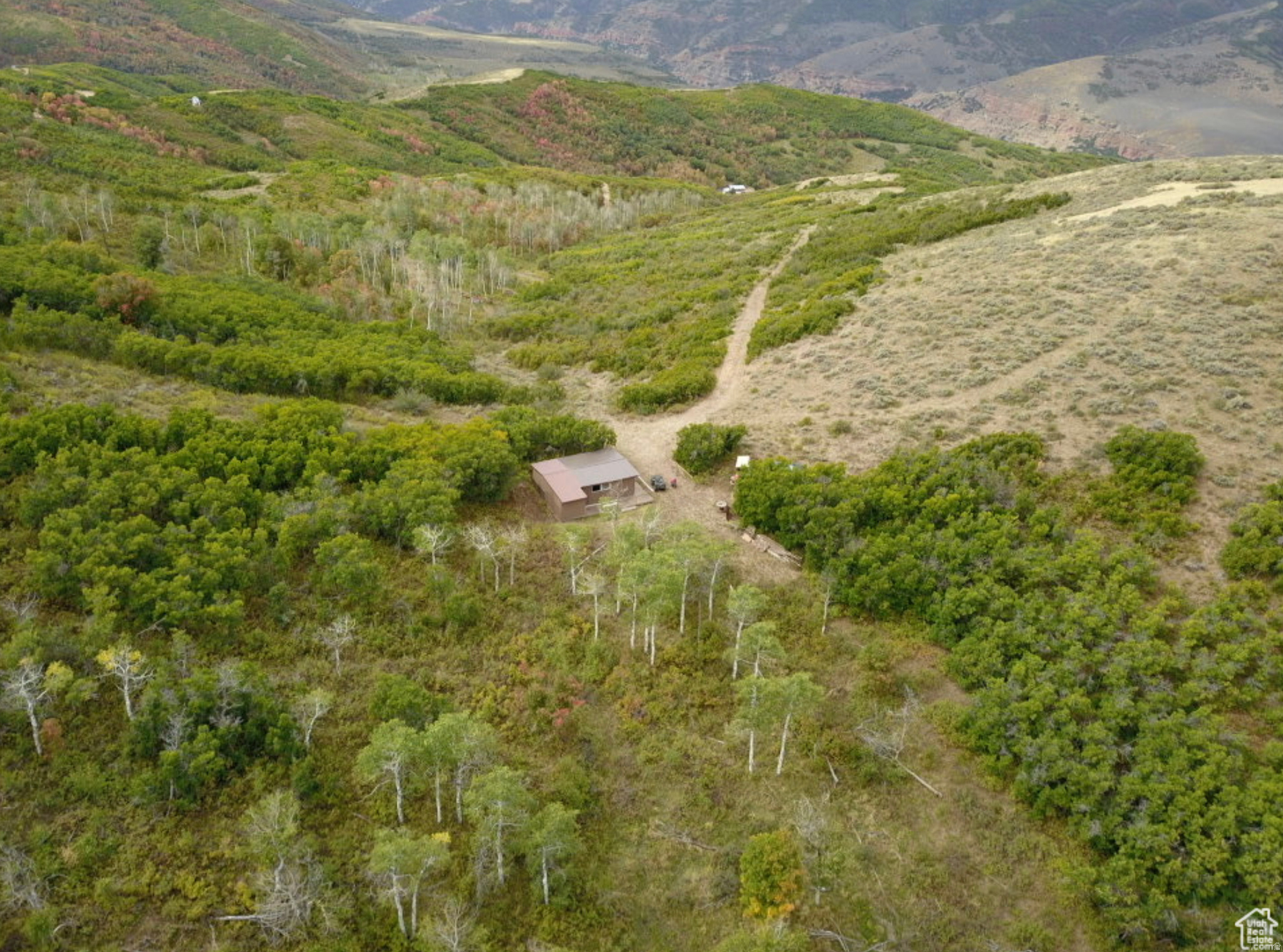 Come take a look at this mountaintop recreational lot, which includes some impressive views and your own private bunkhouse! This lot is just over 23 acres, and there is a leveled flat spot at the top of the lot where a bunkhouse has been built and is wired for generator hook-up! If you want a secluded mountain lot away from the hustle and bustle of the city, or maybe your own private land to hunt on, this property is for you! This is a gated community; you will need a key and an agent to accompany you on any showings. Year-round access is possible with Snowmobiles or ATV/UTV with tracks. No winter road maintenance so the road is not plowed.
