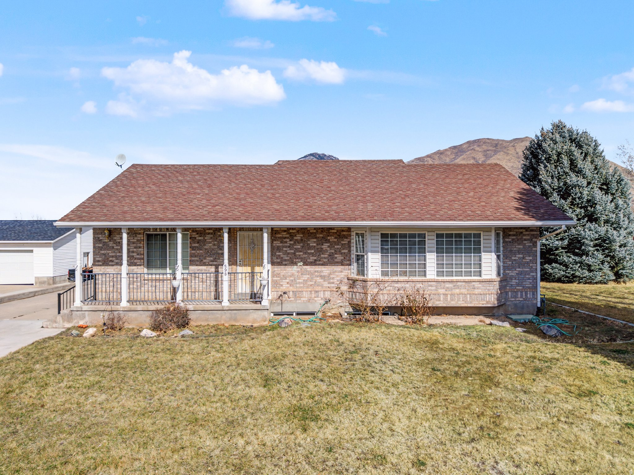 Superb Mapleton suburban homestead.  This rare 1.28 +acre lot with a spacious 5-bedroom, 2.5-bath rambler and finished basement. Located on the west side of Mapleton with big mountain views, this single-level home with full basement offers the ideal blend of country space and suburban convenience.  Inside you'll find an open main floor with a large living room and fireplace, semiformal dining, and an oversized kitchen with bar seating and generous cabinet storage-perfect for canning, meal prep, and hosting.  The main-level primary suite, and convenient laundry make daily living simple, while the finished basement adds more bedrooms, a huge recreation room, and a dedicated storage/pantry room for food storage and supplies.  ?? Outside is where this property really shines for homesteaders: a deep, flat 1.28-acre lot with room for gardens, fruit trees, chickens, goats, horses, or a small hobby farm, fencing and utilities to the back acreage make it farm ready ,plus existing outbuildings and ample parking for trailers, RVs, or farm equipment.  The back patio extends your living space outdoors and captures open views of Mapleton's foothills, creating a peaceful setting for summer dinners and sunsets.   With no HOA, easy access to Mapleton and Spanish Fork services, and top-rated Nebo District schools nearby.  *Open House on Saturday June 13th from 12-2pm*