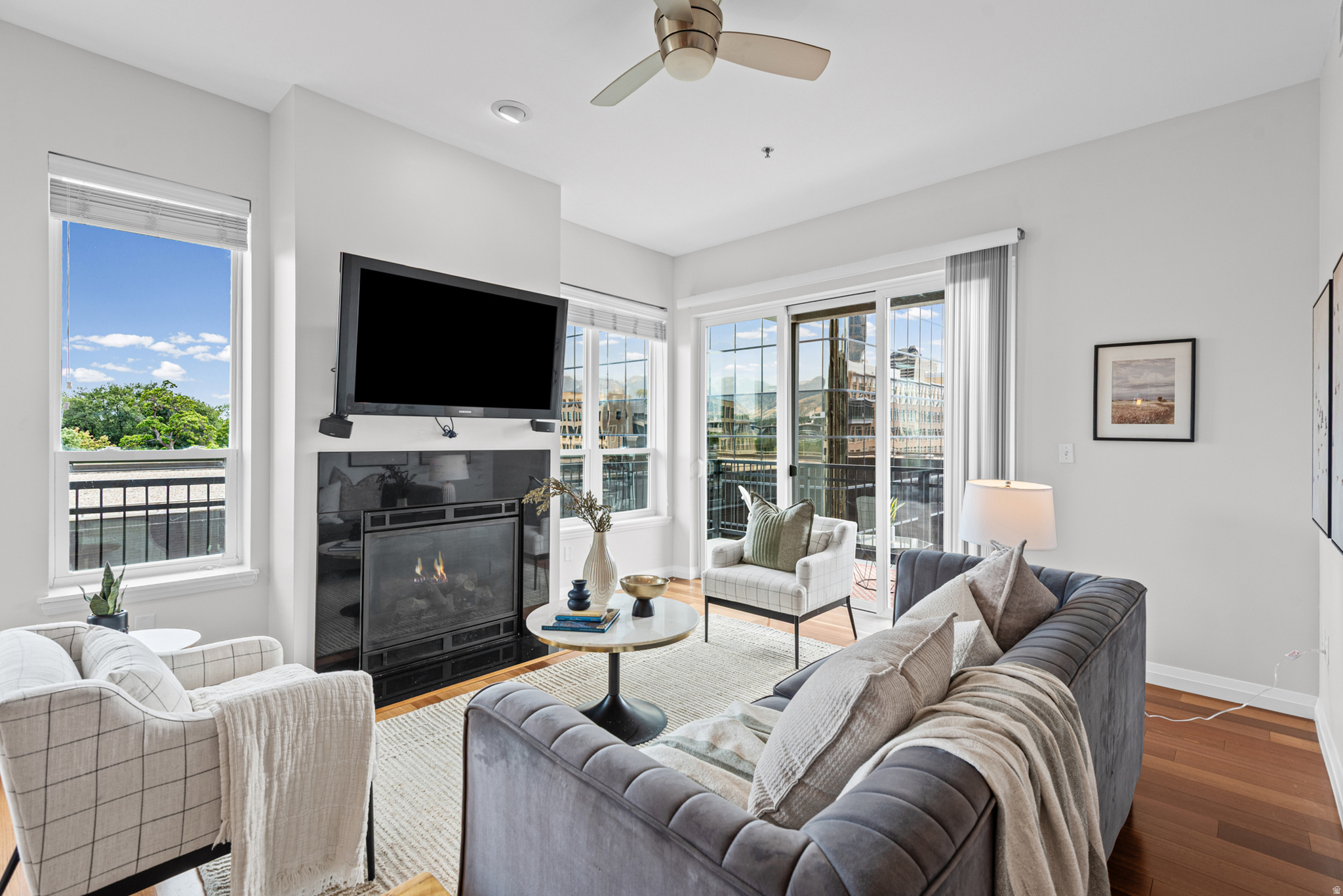 Rarely available corner unit at The Metro! This unique 2 Bed 2 Bath condo boasts tall ceilings, gorgeous natural light, and hardwood floors. Cozy up by the gas fireplace or entertain from the chef's kitchen with a walk-in pantry. Enjoy stunning downtown and Wasatch Mountain views from your large wrap-around balcony plus a private 2nd balcony off the 2nd bedroom. Primary suite features double closets. Includes 2 parking stalls & storage. Steps from TRAX for easy access to downtown restaurants or a free ride to UofU, Jazz, or Mammoth games! Unit has desirable rental rights which may be transferred to new owners.