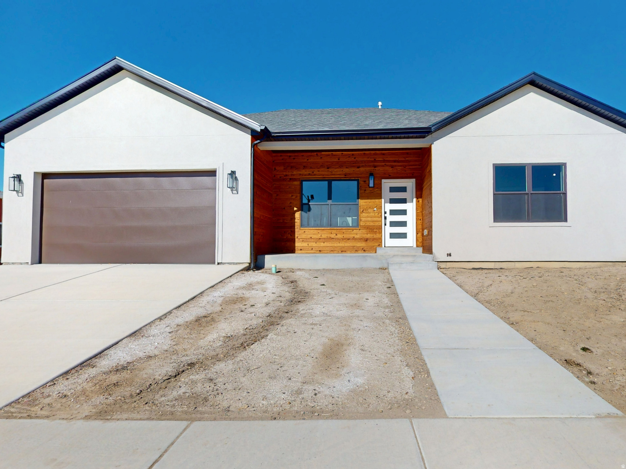 Experience the height of contemporary living in this stunning single-level new-construction home, showcasing a sleek modern design with dark finishes and brushed nickel fixtures. This spacious home features three bedrooms, two bathrooms with double sinks, and a two-car garage, providing ample space for family and vehicles. The chef's kitchen is equipped with all-new G.E. stainless steel appliances, Corian countertops, a farmhouse sink, and a dedicated cabinet for your wastebasket. Additional storage includes a generous pantry and closet organizers. The luxurious master bedroom and dining room both open to a welcoming back patio, ideal for outdoor relaxation. Modern conveniences include plumbing for a water softener and garage outlets ready for electric vehicles. First-time buyers may qualify for a $20,000 grant to use toward closing costs or a down payment-ask your agent for details.