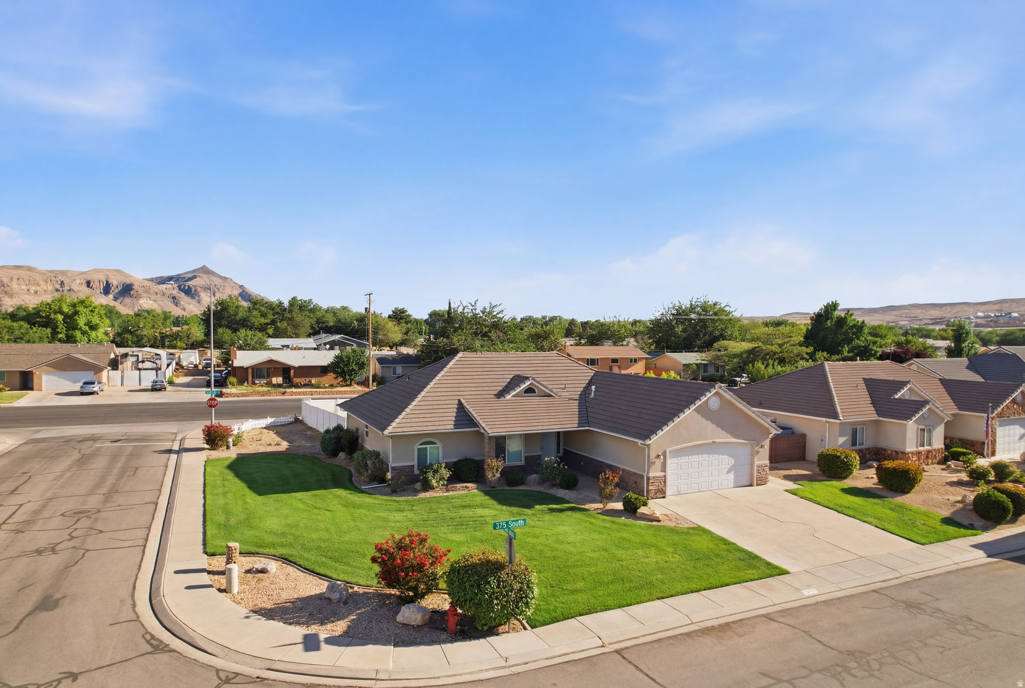 Welcome home to a rare find in the heart of Hurricane, Utah. Nestled on a quiet cul-de-sac street within the highly sought-after Cobblestone Fields neighborhood, this charming property offers the perfect blend of prime location and neighborhood tranquility, all with the incredible bonus of having no HOA. Situated on a generous 0.31-acre corner lot, this single-family home features four bedrooms and two and a half bathrooms spread across a comfortable 1,995 square feet of living space.   Inside, you will find a functional layout anchored by a cozy gas fireplace that provides a welcoming focal point for gatherings. The interior highlights include the convenience of a central vacuum system and an extra-large primary bedroom that serves as a spacious private retreat. The home is priced perfectly for a buyer looking to step in and customize the finishes to their exact preferences and style.   The expansive exterior of the property is just as impressive and full of potential. The fully fenced backyard serves as a private oasis, complete with a covered back patio ideal for evening relaxation, a large dedicated garden area for those with a green thumb, and generous space for RV or boat parking. An extra-wide two-car garage provides plenty of additional storage for vehicles and outdoor gear.   To top it all off, the location is unbeatable for an active lifestyle, offering effortless walking distance to the local elementary and high schools, nearby shops, restaurants, parks and the movie theater. Best of all, you are just a short walk from the upcoming Coral Cliffs entertainment center expansion, making it easy to enjoy bowling, arcade games, and dining right down the street. This property represents an incredible opportunity to plant roots in an established, peaceful neighborhood while creating a dream home on a wonderful piece of land.