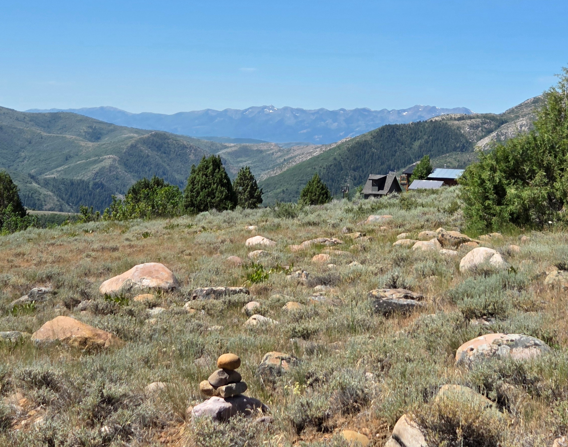 Fabulous Views from this 2.09 acre lot in the Evergreen Park area above Huntsville, Utah. Nestled on the back side of the Wasatch Front, this area offers rolling mountain landscapes, and cool, breezy summers at nearly 7,000 feet elevation. Just 13 miles from Huntsville, which is close to three ski resorts, as well as Pineview and Causey Reservoirs, offering endless outdoor activities such as hiking, mountain biking, paddling, kayaking, RZR riding, and snowmobiling. This lot features a sloped grade to take in the views & requires a well and septic system to build a cabin or home. Minimum build requirement is 450 sq ft.  Enjoy the freedom of no HOA restrictions and County guidelines, Roads are not plowed or maintained. Embrace Utah's outdoor lifestyle with this incredible investment opportunity. This property is off-grid and has limited access during the Winter Months. Parcel is slightly sloped with trees in the NE corner. BRING your Excavator & make your mark on the world! Contact the Agent for directions. Sign on the lot.  There is a possibility of Seller Financing.