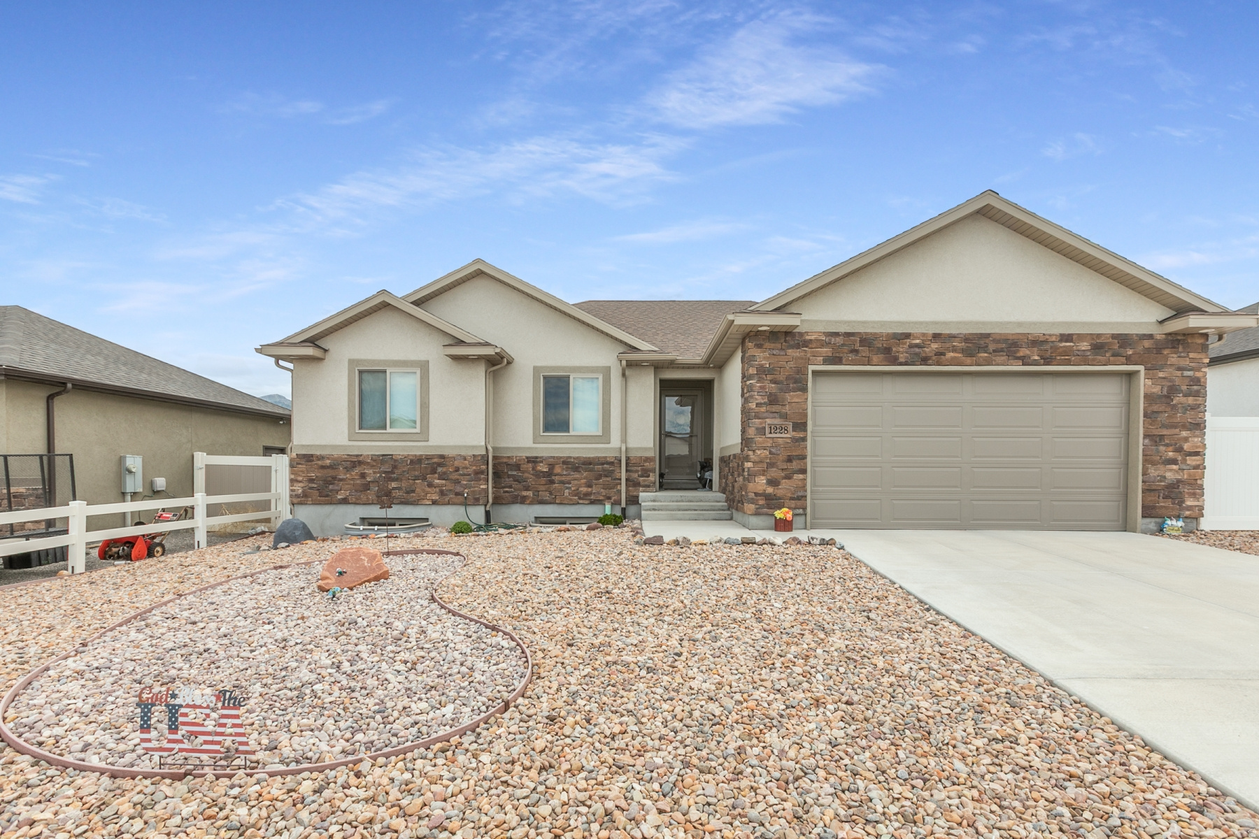 Maticulouse Living Inside & Out!! This exceptional 3-bedroom, 2-bath home, built in 2020, offers 2,680 sq. ft. of thoughtfully designed living space, quality upgrades, and an unbeatable Tooelle location just minutes from everything. Enjoy this gorgeous open kitchen featuring a large island for great gatherings, granite countertops, custom cabinetry, storage pantry, stainless steel appliances, flat-top range, dishwasher & refrigerator.  You will love the timeless hardwood flooring, 3 tone paint & formal living area on the main level.  Spacious master suite offering vaulted ceilings and a luxurious ensuite with granite countertops, adult-height cabinetry, tile tub surround, and a deep soothing soaking tub that has never been used.  Relax outdoors on the extended patio with low-maintenance xeriscape landscaping, drip irrigation, a new screen door, and mountain views.  Unfinished basement offers oversized faux-rock window wells, plumbing for a future bath, cold storage room, a tankless water heater, water softener, and plenty of extra room to grow. Located just minutes from shopping, dining, parks, schools, and the new Smith's Marketplace & Costco. Pride of ownership shines throughout-you will love coming home!