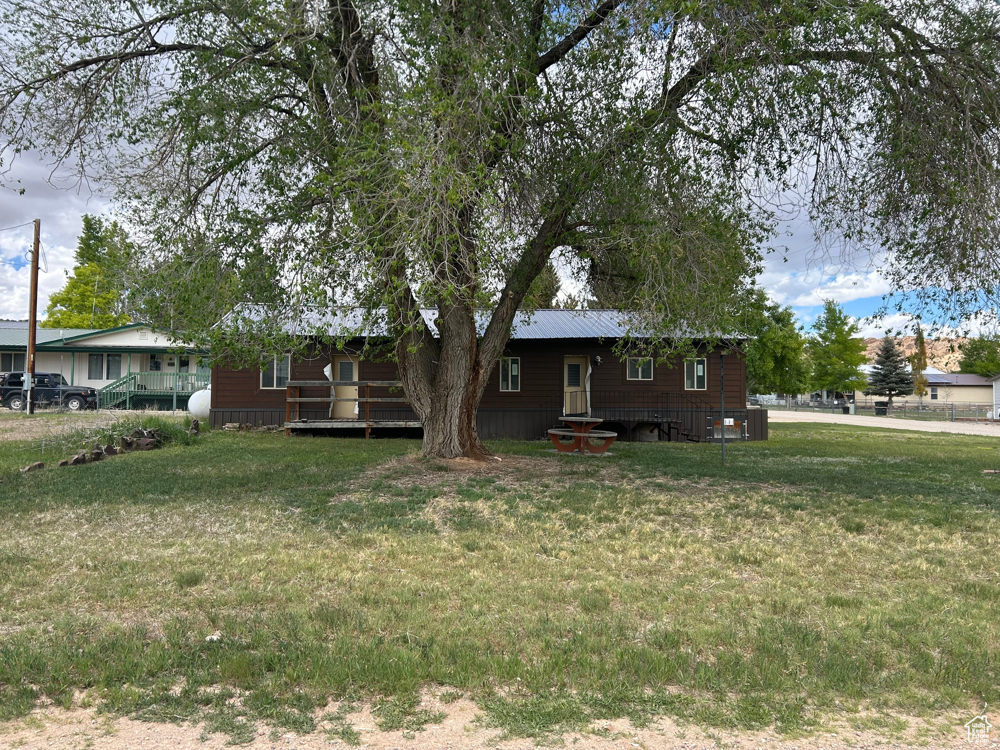 3-bed, 1-bath home near Flaming Gorge! New LP wood-tone siding, triple-pane windows, metal roof & water heater. Corner lot with firepit, porches, RV parking (50-amp), and room for garage. Endless potential. Easy to show-schedule your tour today!    Square footage figures are provided as a courtesy estimate only and were obtained from county.  Buyer is advised to obtain an independent measurement.