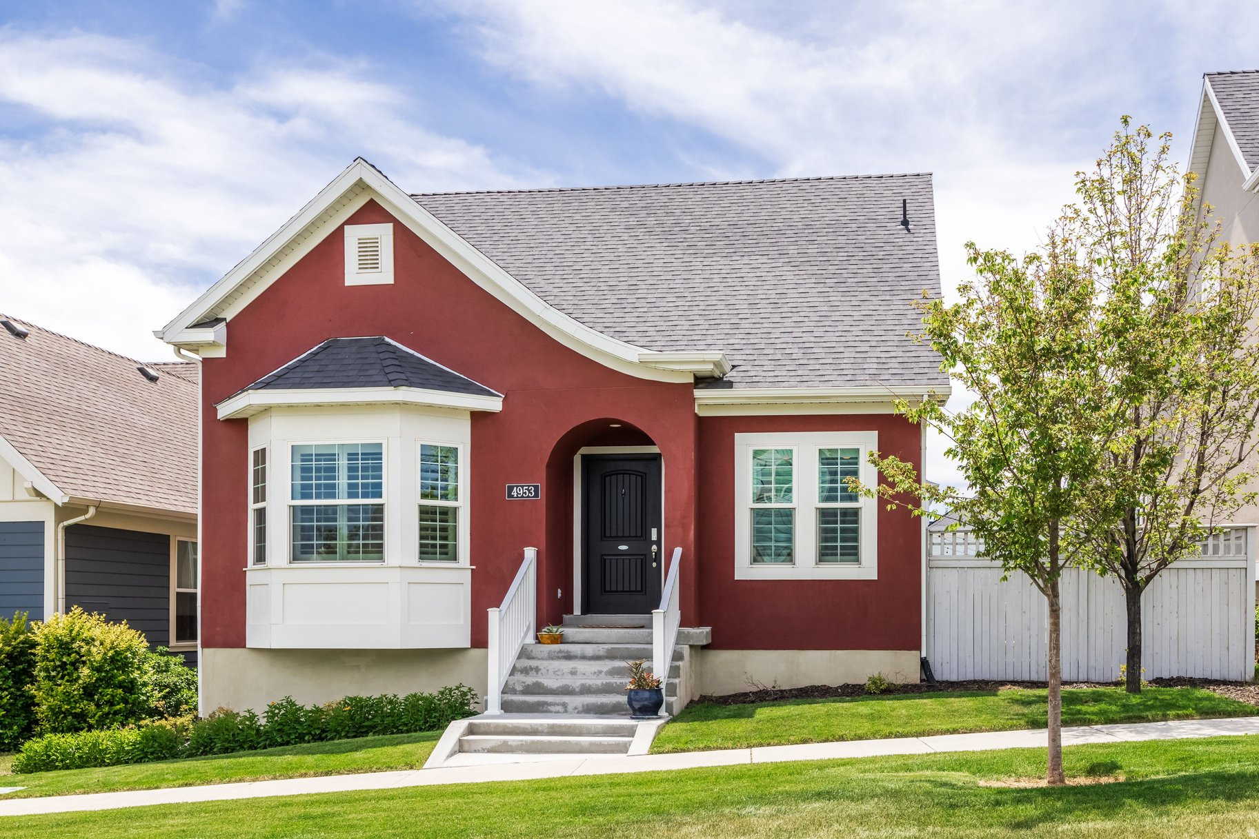 A five-minute stroll from Daybreak Lake, this fully finished, cottage-style rambler home sits in one of the community's prime locations and greets you with custom upgrades in every room and a level of care that is evident from the moment you step inside. Designer fixtures, LED lighting throughout, plantation shutters, and shiplap walls set the tone, while the kitchen pulls it all together with stainless GE Profile appliances, a custom tile backsplash, and warm under-cabinet lighting. At the end of the day, the primary suite offers space to unwind, with an extra-large walk-in closet, a separate toilet closet, and a soaking tub with its own shower. Downstairs, the basement feels just as open thanks to upgraded nine-foot ceilings. Out back, a custom French door opens to a private yard with luxury pet-friendly artificial turf, and a patio already wired for a future hot tub. The extra-wide, extra-deep garage provides plenty of storage space, and the unique extra-wide driveway makes parking multiple vehicles easy. Behind the scenes, a high-efficiency HVAC system, water softener, and included washer and dryer keep everyday living comfortable. Living in Daybreak means having it all close by. Spend summer days on the lake, explore miles of walking and biking trails, and enjoy easy access to shopping, restaurants, parks, and community pools. You're also just minutes from the Mountain View Corridor for an easy commute, and close to the buzz of Downtown Daybreak, home to the new Ballpark at America First Square, where the Salt Lake Bees play. With downtown Salt Lake City and world-class ski resorts roughly 40 minutes away, weekend getaways and city outings are effortless. This location truly delivers the best of the Daybreak lifestyle. Beautifully maintained, move-in ready, and full of thoughtful touches, this one is ready for its next owner.