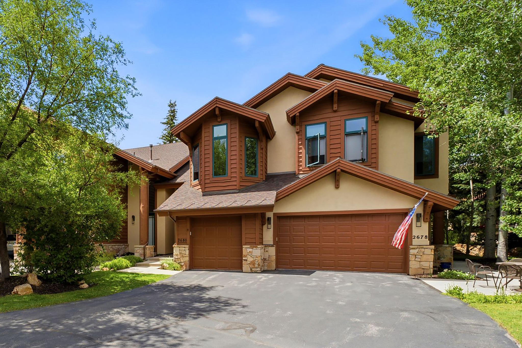 Ideally located in the coveted Cove at Eagle Mountain in Park Meadows, 2680 Gallivan Loop offers the perfect opportunity to enjoy one of Park City's most desirable neighborhoods. This end-row townhome provides the flexibility to enjoy as-is or create the Park City retreat of your dreams.   The bright main level is designed for comfortable everyday living and entertaining, featuring hardwood flooring, an beautifully updated kitchen, and a warm living room with gas stone fireplace. Just off the kitchen, a private patio surrounded by mature landscaping creates a peaceful outdoor retreat for morning coffee, dining, or relaxing after a day on the trails or slopes. The laundry room and an attached garage with a built-in workbench complete the main level.   Upstairs, both bedrooms feature en-suite bathrooms, offering privacy and comfort for owners and guests alike. The spacious primary suite includes a beautifully remodeled bath and its own private balcony. Generous closet space throughout the home provides exceptional storage rarely found in townhomes of this size.   Residents of The Cove enjoy outstanding community amenities, including a pool, hot tub, clubhouse, tennis and pickleball courts, all just moments from Park Meadows Country Club, the Round Valley trail system, and the MARC. Historic Main Street, Park City Mountain, Deer Valley, shopping, dining, and schools are only minutes away, making this an exceptional choice for a primary residence, mountain getaway, or investment property.