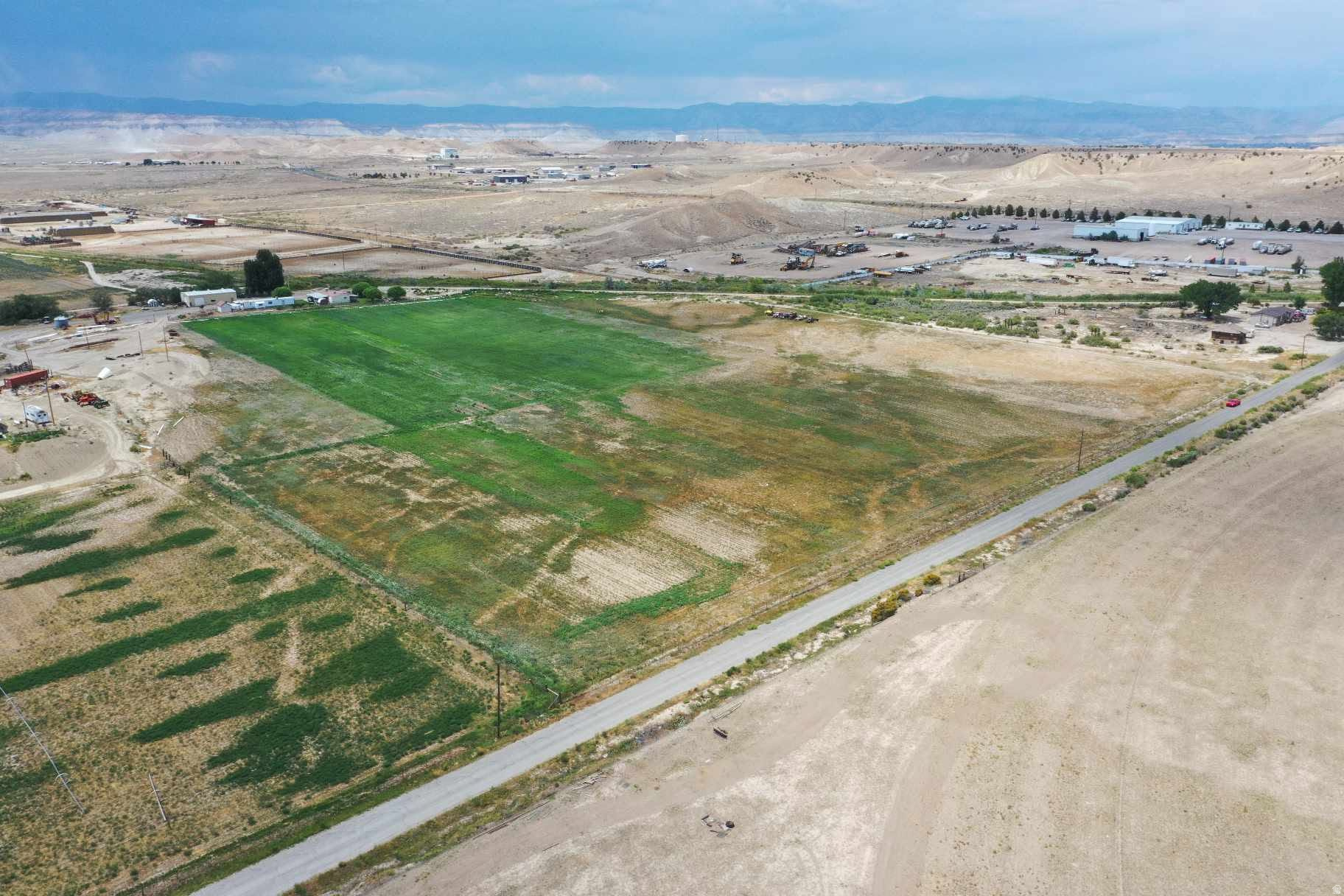 Discover the perfect canvas for your dream project on this expansive 3.71-acre building lot in the heart of Carbon County, Utah. Just a five-minute drive from town, this property combines rural tranquility with convenient access to local amenities. With a rich history of productive farming, the lot is surrounded by vibrant alfalfa fields and breathtaking mountain views that create an inspiring backdrop for your new venture. Imagine designing a custom home or an innovative business retreat where nature meets modern comfort. The nearby Carbon Canal, within easy walking distance, provides excellent irrigation opportunities, enhancing the sustainability of your future development. Seize the opportunity to own a piece of Utah's timeless landscape and turn a well-tended farm into a personalized masterpiece. Your new beginning awaits in Carbon County, where potential and picturesque surroundings come together to create the perfect setting for your vision. Square footage figures are provided as a courtesy estimate only and were obtained from Carbon County. Buyer is advised to obtain an independent measurement.