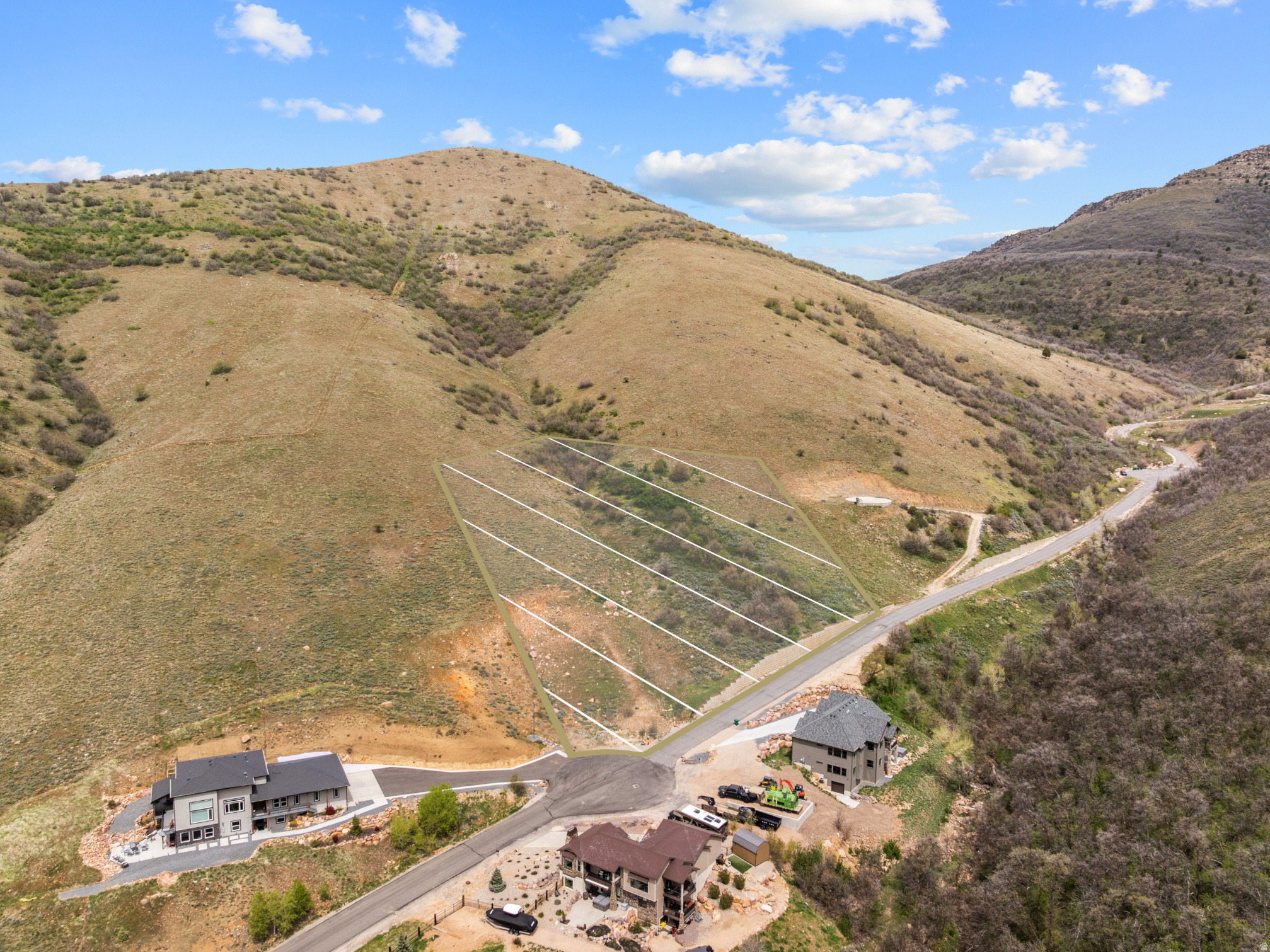 Build your dream home in Green Hills Country Estates. Located on 3.72 acres at the end of a quiet cul-de-sac, this homesite captures panoramic views of Ogden Valley, Pineview Reservoir, and the world-class slopes of Snowbasin. From sunrise over the mountains to fiery sunsets at day's end, the scenery here is nothing short of breathtaking. Step directly from your property into the National Forest for endless adventure-hiking, biking, horseback riding, fishing, hunting, and winter fun are right at your doorstep. World-class destinations like Snowbasin, Powder Mountain, Nordic Valley, and Pineview Reservoir are all just minutes away. For dining, shopping, and culture, Ogden's Historic 25th Street is only 20 minutes down the canyon, with Salt Lake City International Airport less than an hour's drive.  Green Hills is a thoughtfully designed community with CC&Rs that protect long-term value, while the HOA maintains the roads, pond, and even provides an annual cleanup dumpster. Central water and sewer are available through the Green Hills Water & Sewer District.  A Reconnaissance Study is available to confirm buildable areas, giving you confidence as you design your custom home to make the most of those unforgettable views. *All property information, boundaries and documents to be verified by buyer.