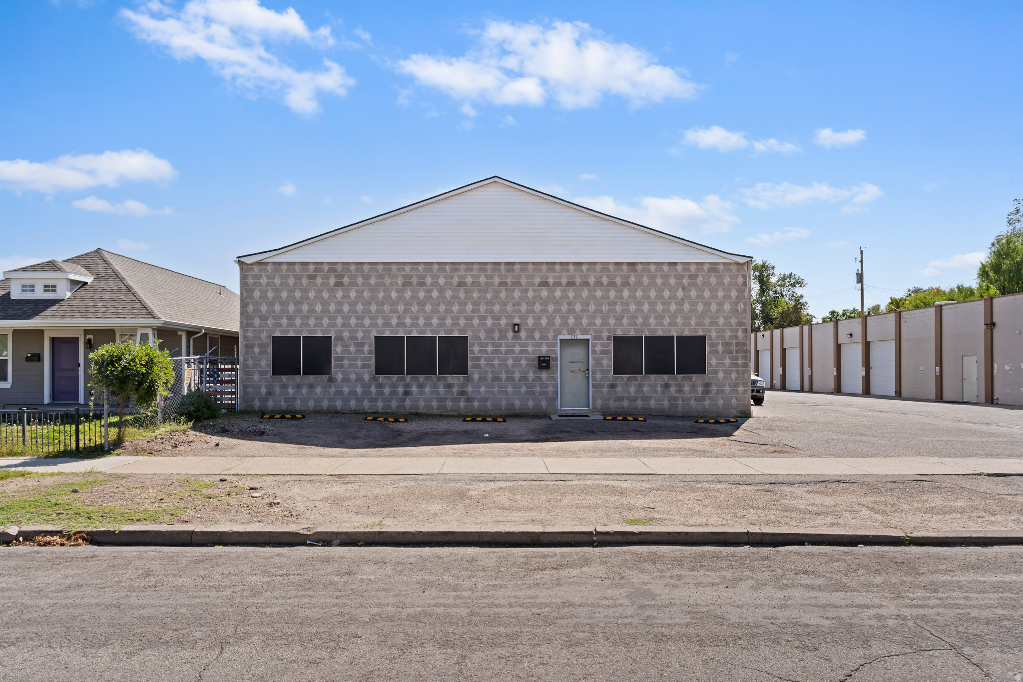 Industrial flex space offering 5,000 square feet in central Ogden with direct access to major roads and freeway systems. The property combines 750 SF of office space with 4,250 SF of warehouse/production area, available for immediate occupancy. Key features include an 8' x 10' overhead door for loading operations, single-phase power, and attic storage that adds usable space without increasing your footprint. Secure yard space provides additional room for equipment staging, fleet parking, or outdoor storage. The property's R-MFV zoning supports various permitted uses. Located in Ogden's commercial core, this property provides straightforward access to major transportation corridors while maintaining proximity to the city's business districts. The combination of office and warehouse space suits distribution operations, light manufacturing, contractor businesses, or service companies requiring both administrative and operational facilities. Ogden City HUBZone certified.