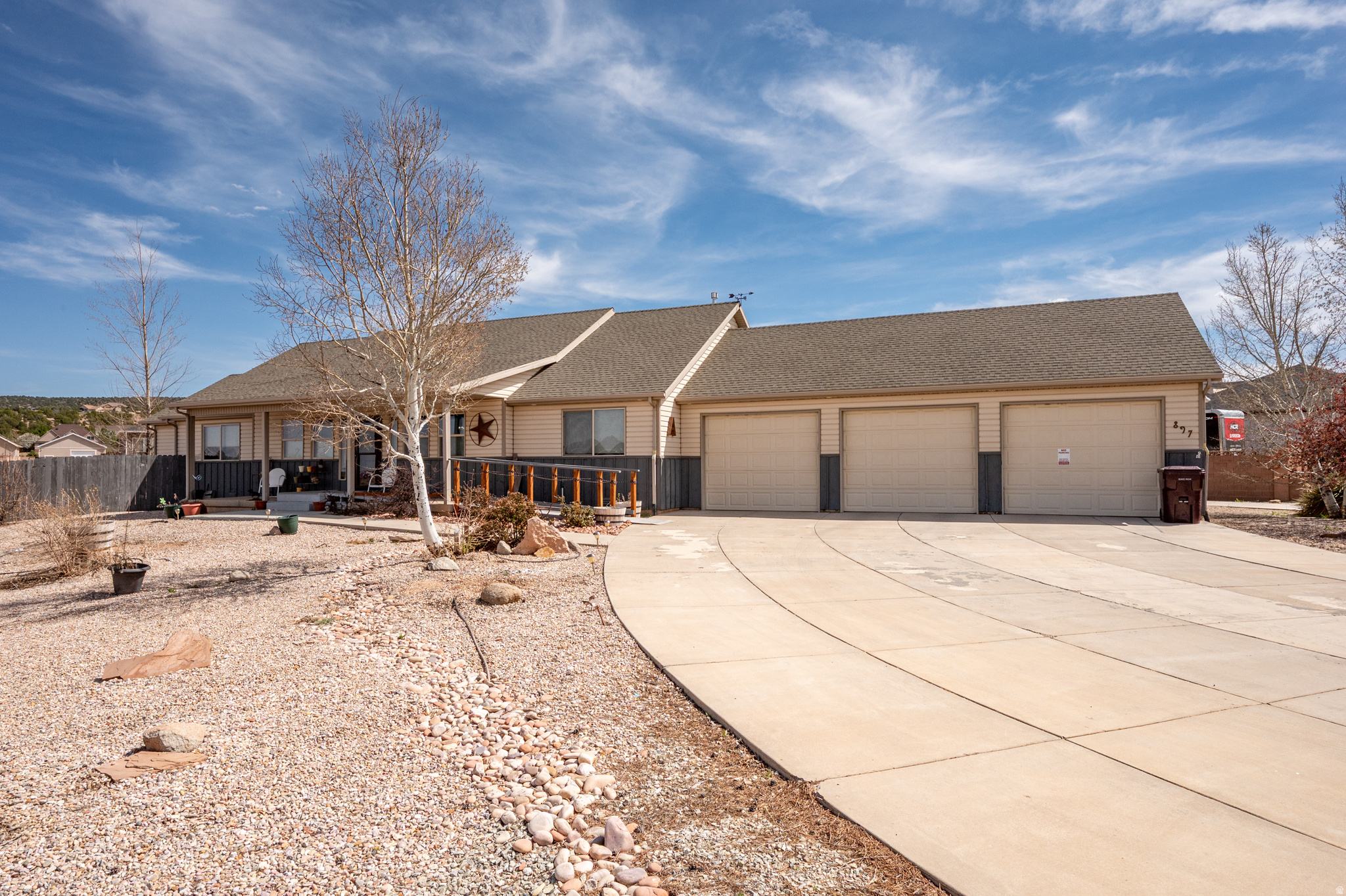 Welcome to easy one-level living in Westview Estates of Cedar City! This 2,200+ sq ft home sits on just over half an acre and checks all the boxes-4 spacious bedrooms, an awesome kitchen, and a cozy fireplace for relaxing nights. The oversized 3-car garage offers great storage, while the exceptional primary suite features sunroom access and an ensuite with dual sinks, soaker tub, walk-in shower, built-in cabinetry, and walk-in closet. The laundry room impresses with abundant cabinetry, sink and the washer and dryer that stay. The inside fridge is included as well! Wheelchair-accessible ramp ensures comfort and safety for years to come. Outside, enjoy a Trex deck, mature fruit trees, garden area, storage shed, full fencing and extra cement with drive-through gate for RV, boat, or toys. Come see this one for yourself! NO SHOWINGS AFTER 6 PM.