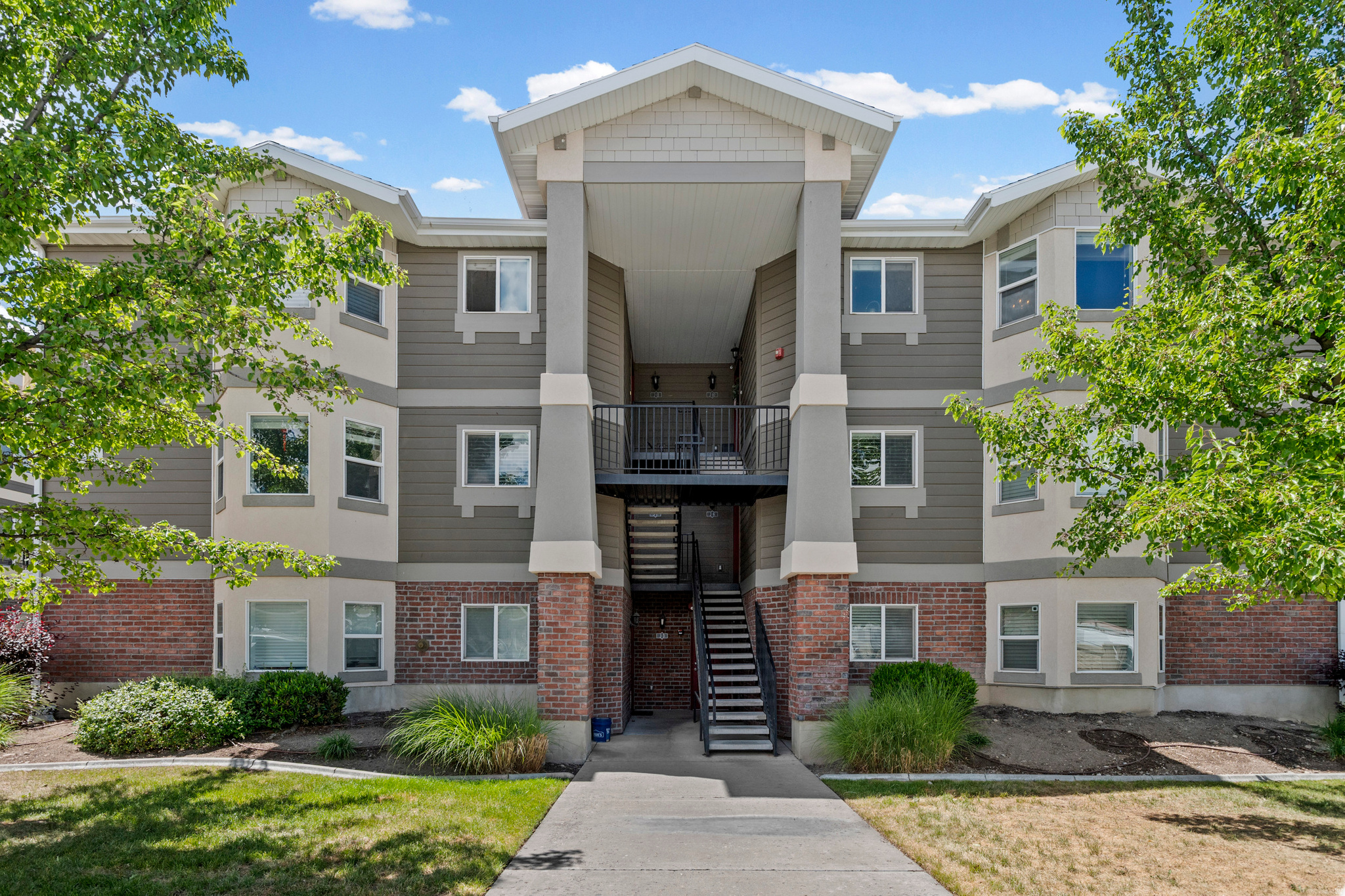 Welcome to elevated living at East Town Village. Perched on the top floor, this bright corner condo showcases breathtaking views of the Wasatch Mountains and offers the perfect blend of comfort, style, and convenience.The open-concept layout is filled with natural light and features vaulted ceilings, a spacious living area, and a chef-inspired kitchen designed for both everyday living and entertaining. The generously- sized primary suite easily accommodates a king-size bed with additional space for furnishings, creating a true private retreat. The primary bathroom features elegant marble finishes, a beautifully designed shower, and a spacious walk-in closet.Two additional bedrooms provide exceptional flexibility for guests, a home office, fitness space, or extra storage. Residents enjoy access to community amenities including a clubhouse, pool, and spa. Conveniently located near world-class skiing and hiking in nearby canyons, with easy access to interstates, transit routes. Minutes from theaters, restaurants, shopping, and America First Stadium.