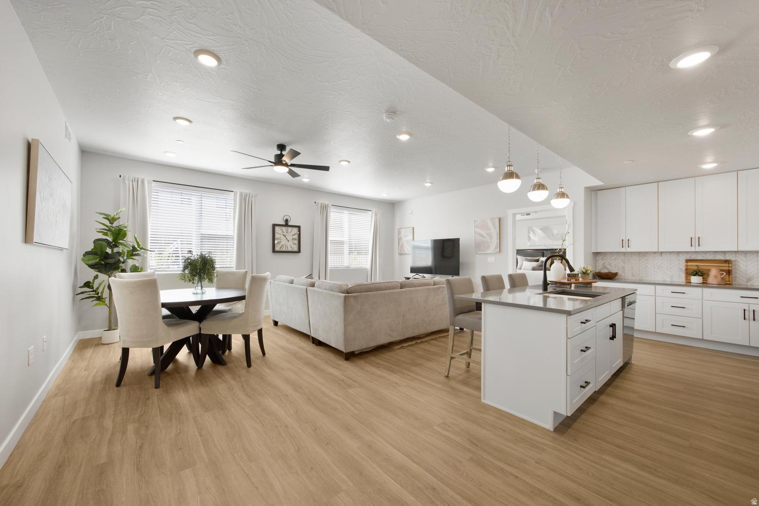 Fully furnished, ground level, ready to book as an STR! This ADA-compliant condo sits in the best spot in the complex, with the pool, lazy river, hot tub, and outdoor kitchen with BBQs all just steps from the door. A neighboring unit is also available for purchase, giving you the option to list both as a combined property on Airbnb for larger groups and stronger nightly returns. Inside, the open-concept layout is designed for connection. The designer kitchen offers stainless appliances and a crisp, contemporary feel, with LVP flooring and recessed lighting throughout the home. Premium furnishings include high quality mattresses, plates, pots, pans, and smaller essentials the builder's package leaves out, making this a truly turnkey unit with nothing left to source. Two bright bedrooms include one with an en-suite bath and accessible shower, and a second full bath houses in-unit laundry for guest convenience. Owners have the flexibility to self-manage or partner with any property management company they choose. Purchase also gives access to the Coral Springs condominium amenities, which include a fitness center, indoor pool, basketball court, and tennis courts. The new Rush Funplex amusement center has recently opened to draw demand to the area. All the setup work is done, just list and start booking!