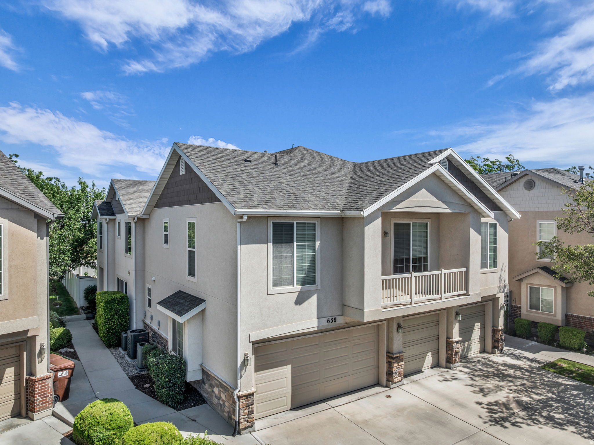 This beautifully updated townhome is ready for you to move right in. Featuring recessed lighting, fresh paint, new carpet, and a primary bedroom with vaulted ceilings, abundant natural light, and a walk-in closet. Major updates already done: electrical panel (2024), furnace (2024), AC (2025), dishwasher (2025), and microwave (2026). Fridge, brand new washer and dryer included! Enjoy your private backyard oasis with stunning sunset and mountain views from the patio. No neighbors behind, one of the larger yards in the community, plus a large shaded grassy area just to the west. Steps from great walking/biking trails, close to numerous parks, and minutes to downtown Salt Lake City, the airport, and area ski resorts. Community amenities include an updated fitness center and swimming pool. Smoke-free home. Fabulous layout, tons of natural light - true move-in-ready living!