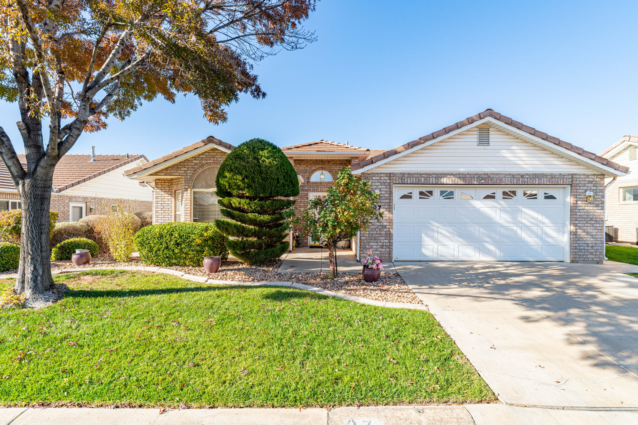 This amazing single-family home located in a highly desirable 55 and older community. Offering 3 bedrooms, 2 bathrooms, and two inviting living rooms, this home is one of the few in the neighborhood that boasts additional square footage, giving you more room to relax, entertain, and enjoy. Step outside to a covered patio perfect for morning coffee, evening gatherings, or year-round outdoor enjoyment. The backyard is a peaceful retreat featuring a unique lava rock fountain, adding a soothing, natural ambiance to the space. Enjoy a low-maintenance lifestyle with an HOA that covers full yard and landscape care, allowing you to spend more time doing what you love and less time on upkeep. This rare find offers comfort, convenience, and a relaxed community lifestyle ? a wonderful place to call home.