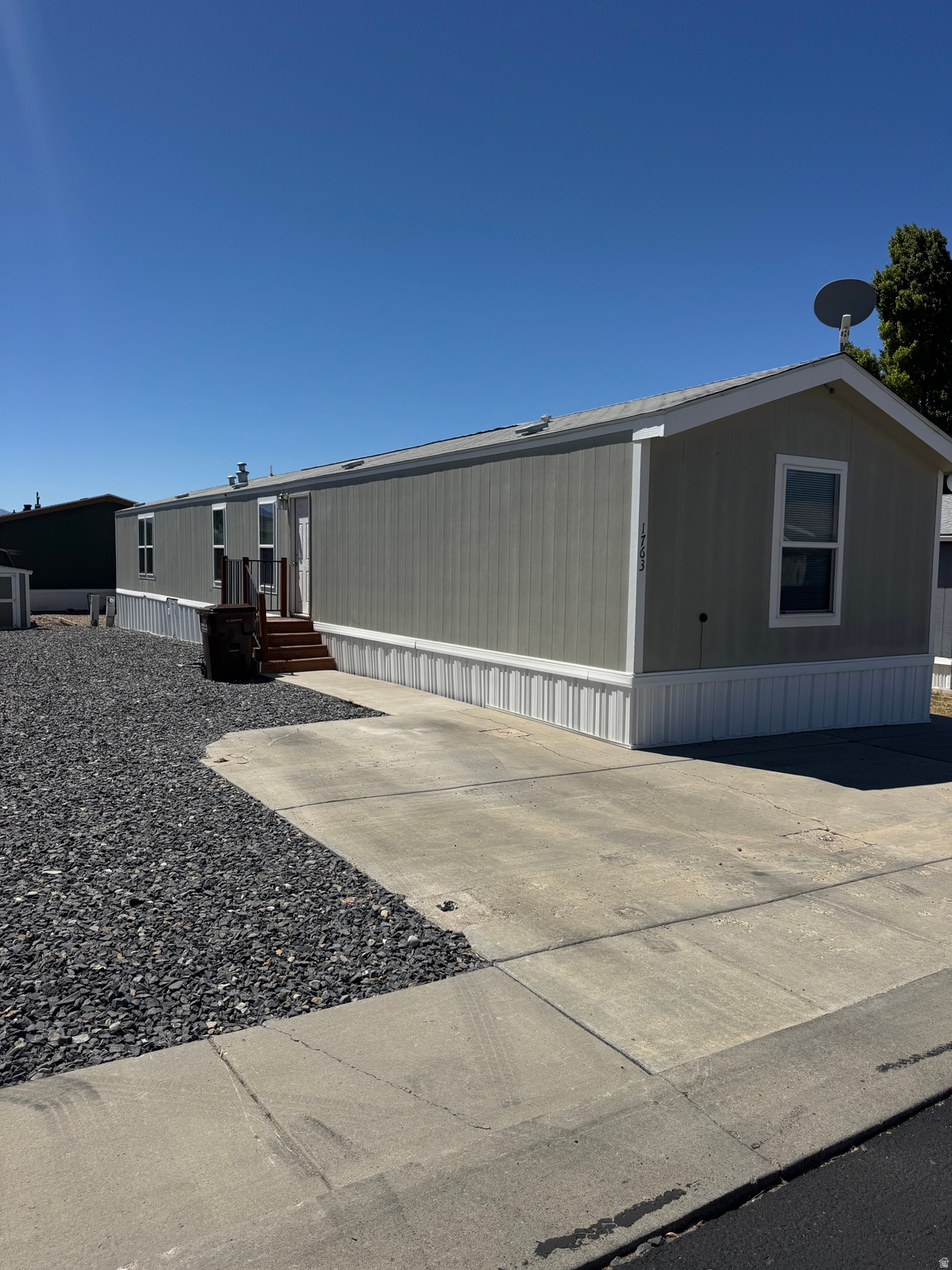 Super clean and spacious home with an oversized Primary bedroom and bathroom.  This home has been very well maintained and is ready for your personal touch! Refrigerator and Washer & Dryer included!  Located in the Overpass Point community close to shopping and freeway access.  Community rental/HOA fee is $896/month and includes basketball court, clubhouse, community events, off-street parking, pets are welcome, playground, picnic area with grill, RV storage, and community newsletter. Utilities are not included in the rental fee. Buyer must obtain park approval through www.Bayshorehomesales.com*Buyer to verify all information*   For Financing, Prime Capital 801-688-3333 or 21st Mortgage 800-955-0021 are both great options.