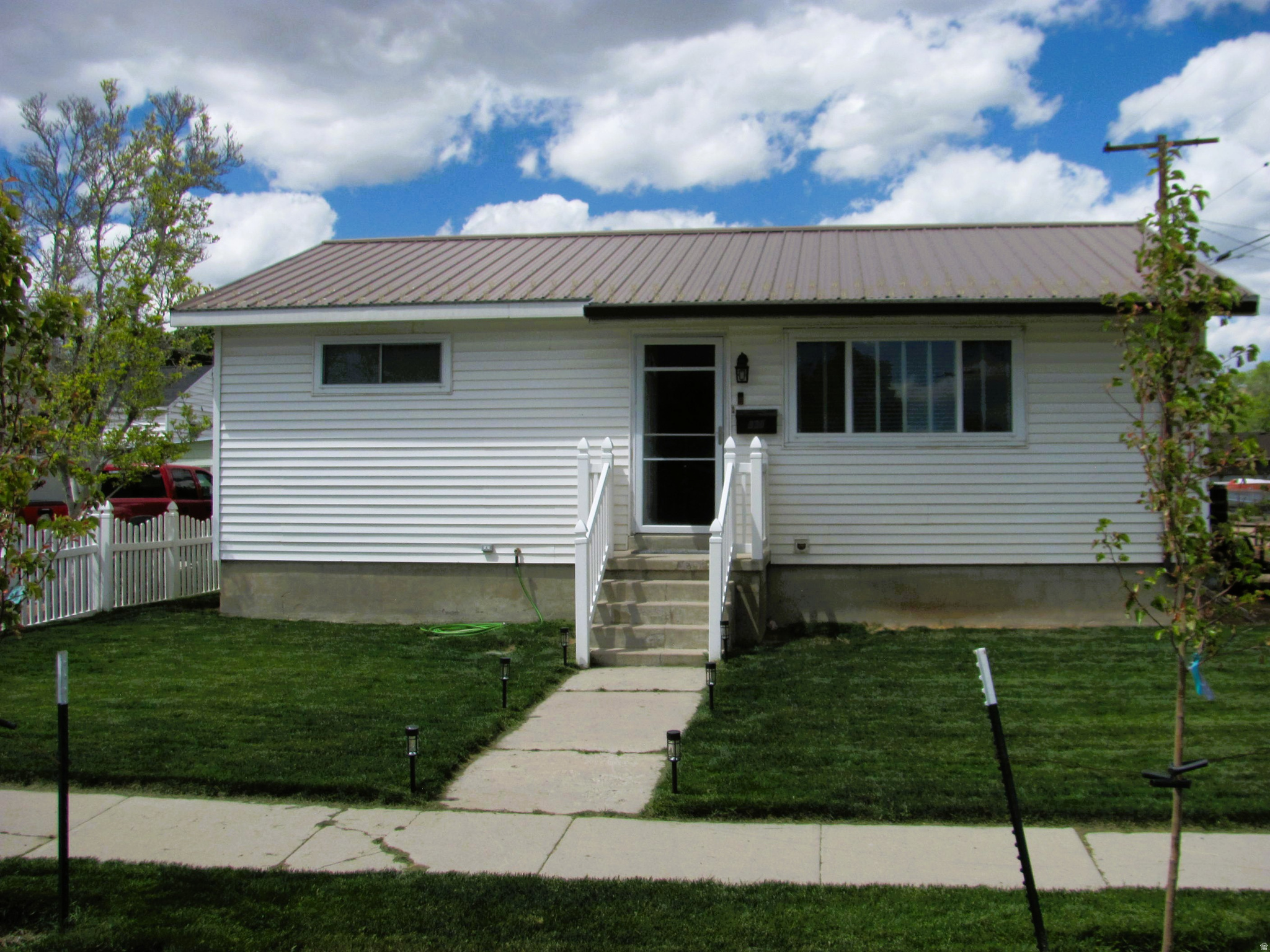 Welcome home to this beautifully maintained 3-bedroom, 2-bath ranch-style home perfectly located in the heart of town! Offering comfort, space, and convenience. Large 2 car garage, metal roof, central air, and more!  Square footage figures are provided as a courtesy estimate only and were obtained from county records.  Buyer is advised to obtain an independent measurement.