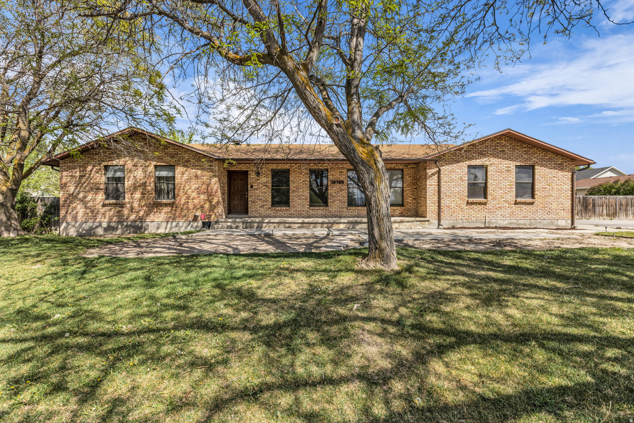 Nestled in the desirable community of Sandy, Utah, this single family home with mother-in-law apartment offers stunning views of the mountains.  built in 1976 and spanning 3,294/sf on a generous 1.250 acre lot.  The home has many updates but needs some TLC.  The home features 5 bedrooms, three full bathrooms, making it ideal for families or those seeking room to grow.  The mother-in-law suite could be used for additional income or to accomodate multi-generation family.  A 40' x 30' detached garage/workshop could easily accomodate a home business or avid woodworker or storage for toys and RV.  Windows have been replaced in 2020 and 2025.  Attached garage is oversized with built in shelving and overhead storage.  Kitchen has a walk-in pantry, quartz counter tops.  This home is being sold AS IS.  Need at least 2 hour notice as their are small children and a dog that needs to leave before showing.  Square footage obtained from County records.