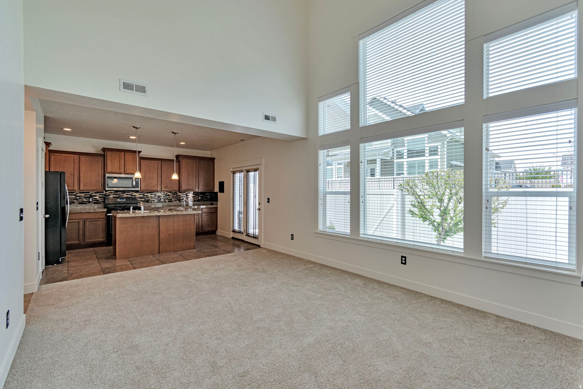 Back on the market, another chance for you to own this beautiful townhome. Step into this stunning end-unit townhome in the heart of Riverton, where an inviting entry and an abundance of windows fill the space with beautiful natural light. The spacious island kitchen is perfect for entertaining, while the large primary suite offers a true retreat with a separate soaking tub, walk-in shower, and double vanity, as well as a walk-in closet.  Freshly painted interiors, new carpet, and a water heater less than three years old add modern comfort and peace of mind, while the included washer/dryer makes this home truly move-in ready.  Unwind in the evenings on your private patio and enjoy the peaceful surroundings. Ideally located near Riverside Golf Course and Riverton City Park, with quick freeway access to I-15 and Bangerter Highway, you'll have shopping, dining, VASA, and entertainment just minutes away. Homes in this sought-after community sell fast-don't miss your chance to own in this quiet neighborhood with low HOA fees!