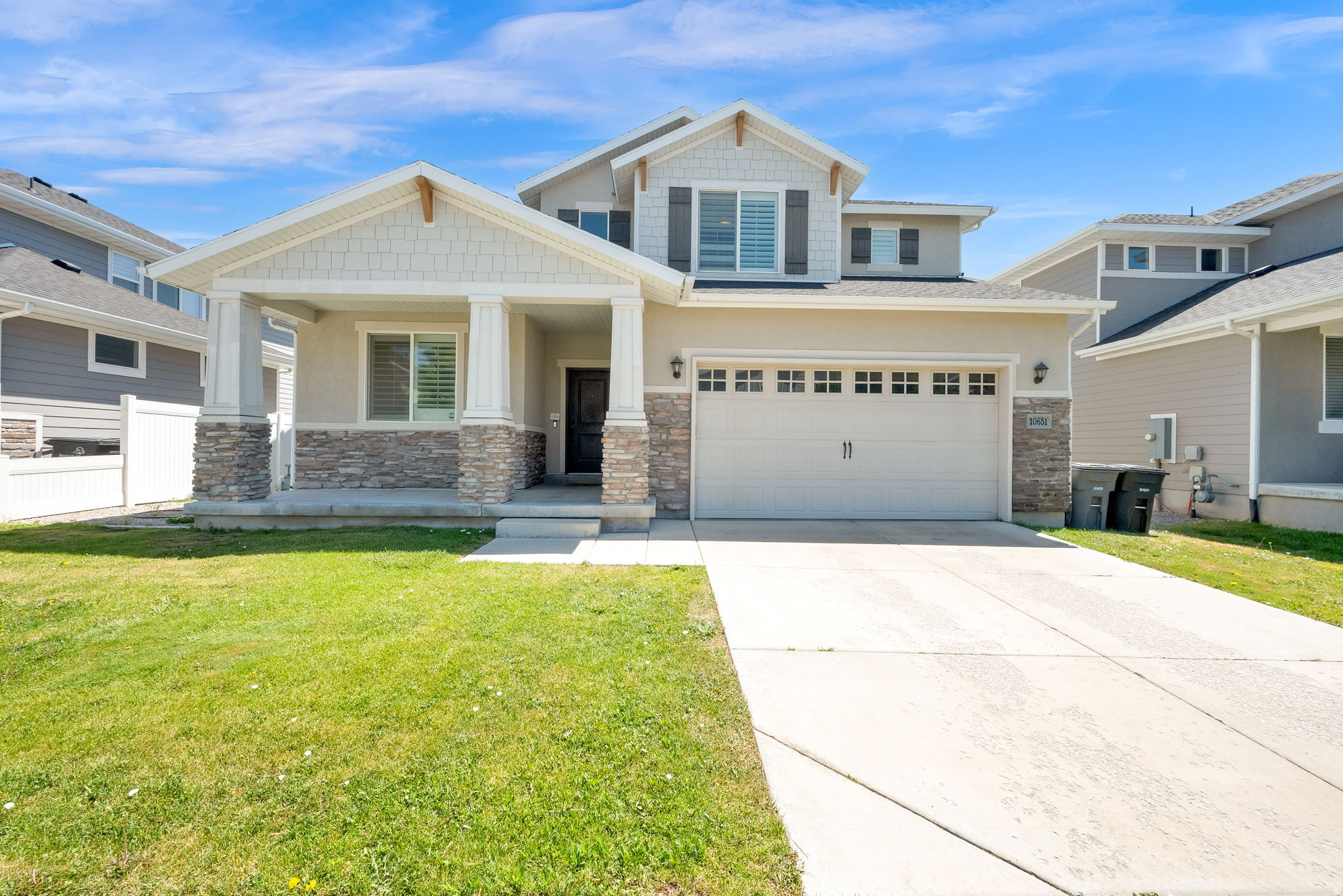 One of the best values in South Jordan! This stunning Craftsman-style home in highly sought-after Rushton Meadows offers an incredible combination of location, space, quality, and price that's difficult to find in today's market. Perfectly positioned on the edge of Daybreak, you'll enjoy convenient access to premier shopping, restaurants, parks, trails, and entertainment-without the added cost of Daybreak HOA fees. With 5 oversized bedrooms, 3.5 bathrooms, and an exceptionally functional floor plan, this home lives far larger than its square footage. Every bedroom offers generous proportions, creating comfortable spaces for family, guests, home offices, or multigenerational living. The showpiece of the home is the remarkable primary suite-truly one of the largest and most impressive you'll find in this price range. Designed as a private owner's retreat, it occupies nearly half of the upper level and feels like its own luxury wing. Relax in the expansive bedroom, enjoy dual walk-in closets, double vanities, and a spacious ensuite bath that delivers comfort, privacy, and everyday luxury. The open-concept main level creates the perfect gathering place with seamless flow between the kitchen, dining, and living areas, making entertaining effortless while still providing warm, comfortable spaces for everyday life. Rich Craftsman architecture, timeless finishes, inviting curb appeal, and abundant storage further elevate the home's appeal. Located in one of South Jordan's most desirable neighborhoods, you'll be just minutes from Mountain View Corridor, Bangerter Highway, Daybreak, top-rated schools, shopping, dining, parks, walking trails, and outdoor recreation. Homes offering this much space, such an exceptional primary suite, and this level of value in Rushton Meadows are increasingly hard to find. If you've been searching for a home with oversized rooms, timeless Craftsman character, an incredible primary retreat, and one of the strongest values in one of South Jordan's premier locations, this is an opportunity you won't want to miss. Square footage figures are provided as a courtesy estimate only. Buyer is advised to obtain an independent measurement.