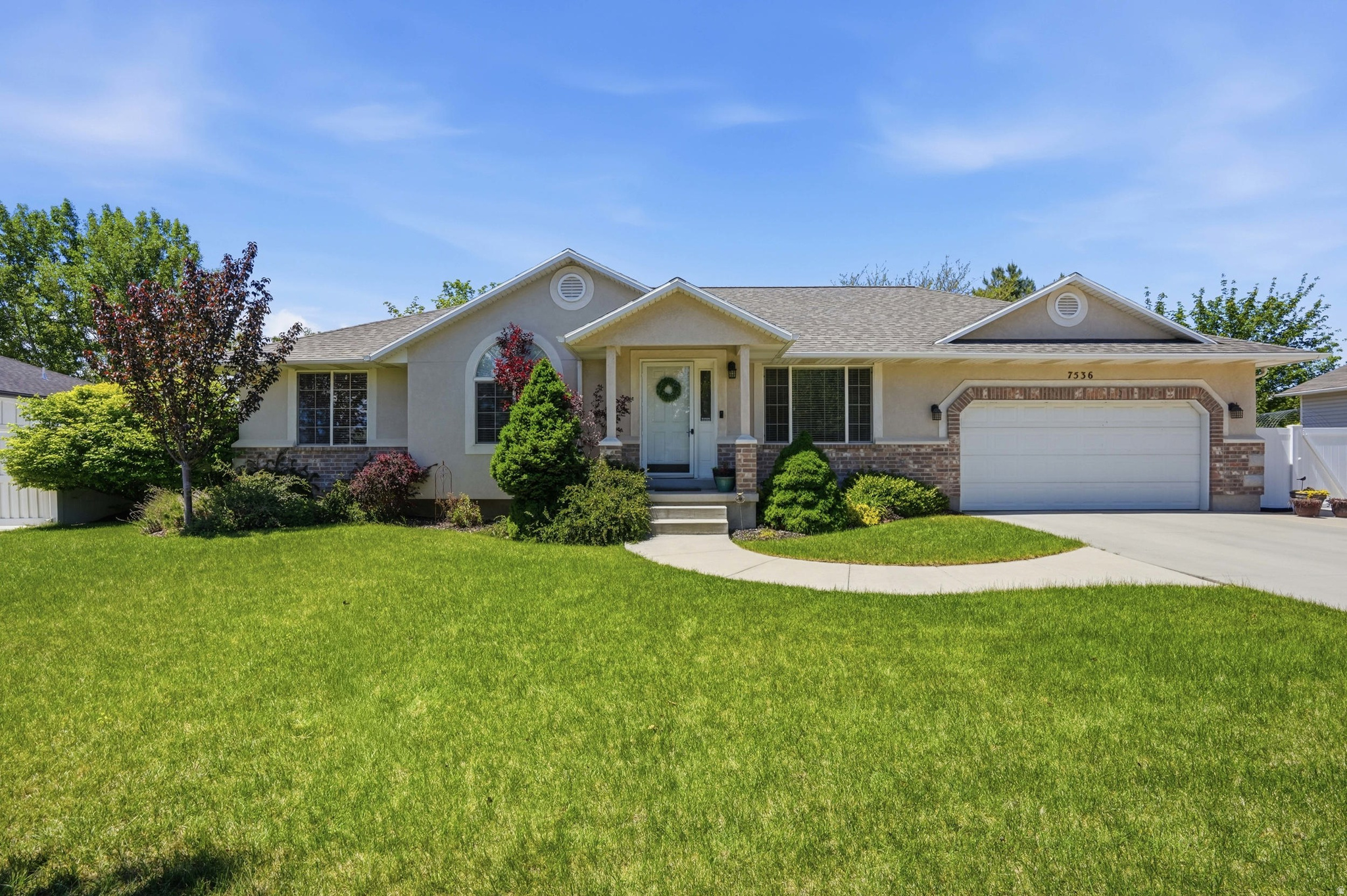 Beautiful rambler on a quiet tree-lined street large lot w/oversized RV parking, mature landscaping, and fully fenced backyard. Vaulted ceilings and engineered wood floors create an open, spacious feel throughout the main living area. Updated kitchen features granite countertops, off-white cabinets, stainless appliances, large island, and bar seating. Main-floor primary suite and laundry/mudroom add convenience and helps keep everyday life organized. Huge basement family room, flex room, cold storage, and oversized 2-car garage provide incredible functionality. Roof replaced - end of 2024. Furnace is newer. Walking distance to 3 beautiful parks and just minutes from Mountain View Corridor and Bangerter Highway. Square footage figures are provided as a courtesy estimate only and were obtained from county records.  Buyer is advised to obtain an independent measurement.