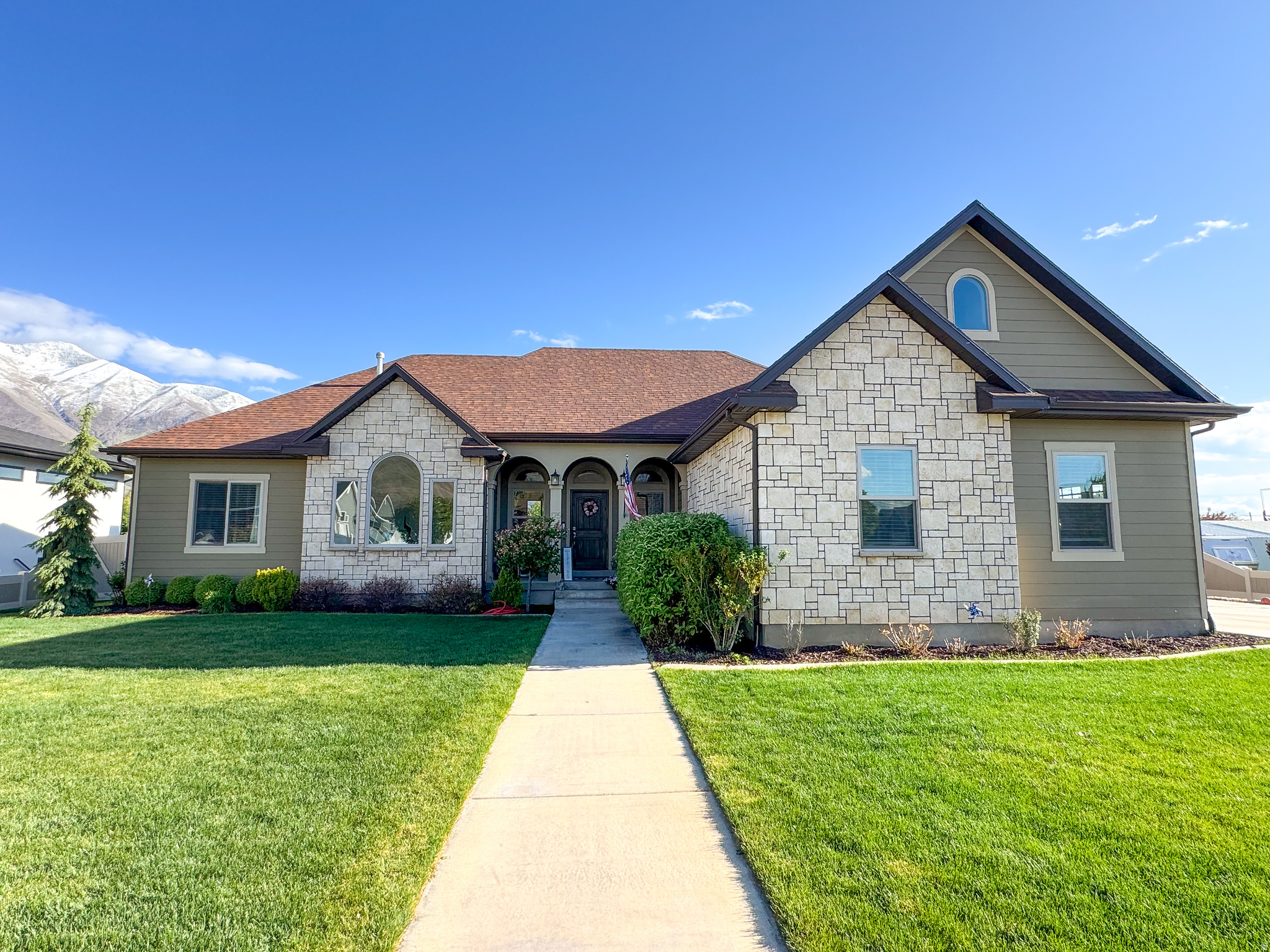 Beautiful custom-built north Mapleton home with stunning mountain views, open-concept living, vaulted ceilings, and thoughtful finishes throughout. Built in 2017 and maintained by the original owners, this home features 3 main-level bedrooms, each with its own full bathroom, plus a front office/flex room and a 500 sq ft loft above the garage with separate HVAC. The kitchen includes custom concrete countertops, custom wood cabinetry, shiplap ceiling detail, double ovens, and a natural gas cooktop. Additional features include a built-in propane fireplace, custom XL tub in the primary bath, two water heaters, water softener, and an unfinished insulated basement with HVAC ductwork, plumbing, electrical, cold storage, and potential for additional living space or apartment-style setup. Enjoy a fully fenced backyard, covered front porch and back patio, beautiful landscaping, built-in trampoline, sand/play area, 3-car garage, oversized driveway, and RV parking area. Located near schools, walking trails, mountain access, canyons, and Bartholomew Reservoir.fr