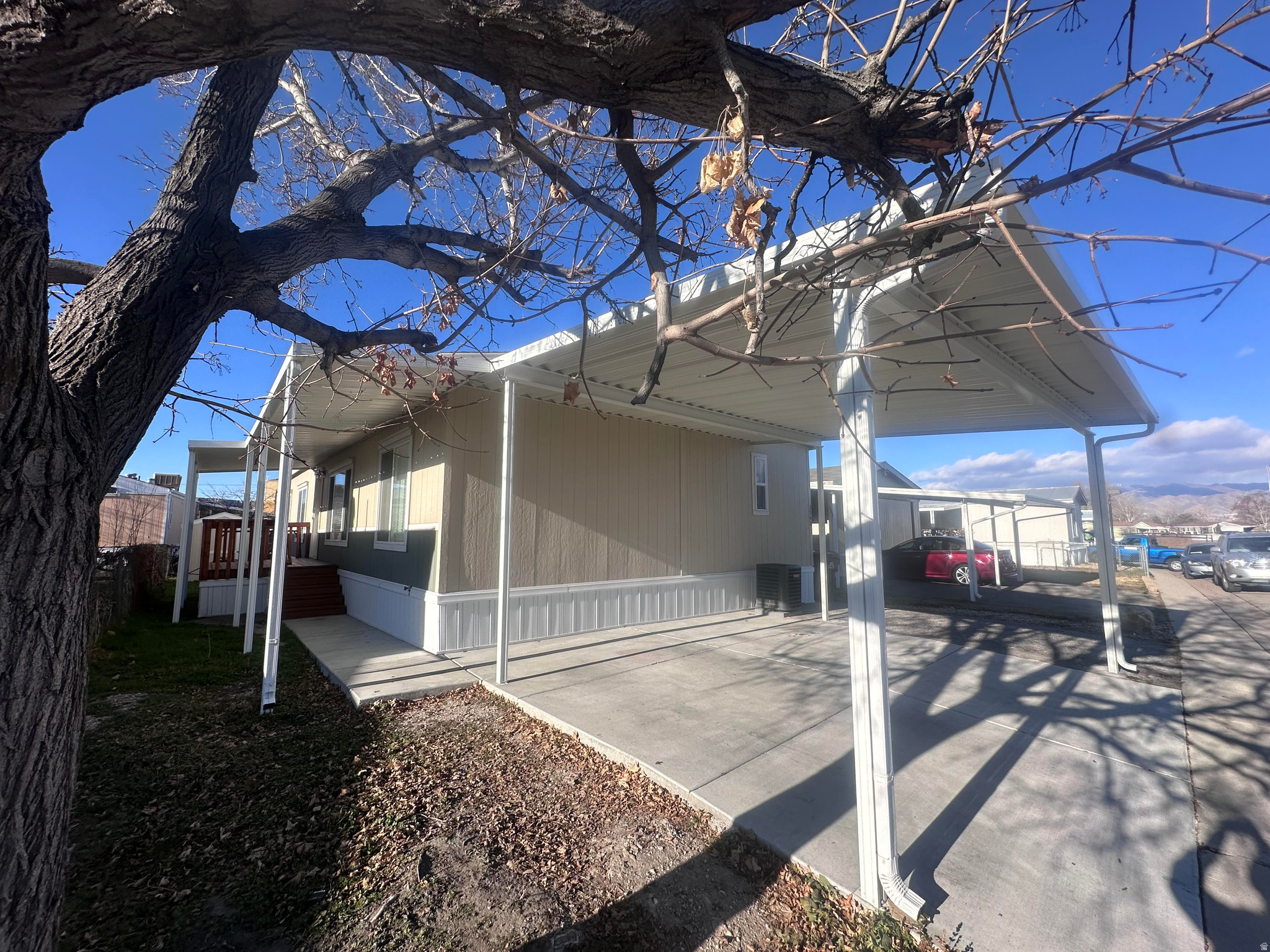 A beautifully maintained double-wide home in the heart of West Valley City that truly has it all. From the open-concept layout and the modern kitchen with stainless steel appliances to the cozy living spaces and private backyard.  The spacious master suite and walk in closet with a decent size bathroom.  Two family rooms for entertaining.  This home is all Electric and is basically still new.  It comes with 3 parking spaces (two of them covered) and a shed.  This amazing home is waiting for it's new family. Square footage figures are provided as a courtesy estimate only and were obtained from the county records. Buyers are advised to obtain an independent measurement.