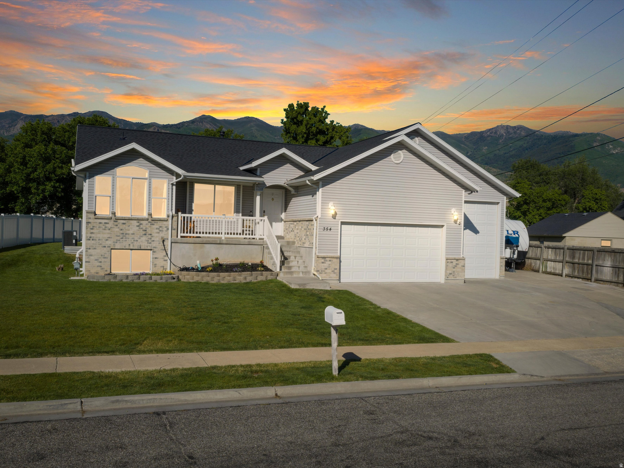 Move-in ready spacious rambler offering nearly 3,000 sq ft of finished living space in the heart of Kaysville! Situated on a beautifully landscaped .28-acre lot, this well-maintained home features an oversized 4-car garage, 40-foot RV parking space, and a detached 12' x 18' shop/shed. Enjoy the well-cared-for yard and large covered back patio, perfect for relaxing, entertaining, and spending time outdoors. Conveniently located within walking distance to parks, shopping, and everyday amenities, this home offers the perfect combination of space, storage, and location. The main level features 3 bedrooms, 2 bathrooms, and an open-concept family room and kitchen with vaulted ceilings, a gas fireplace, and large windows that fill the space with natural light. Designed for comfortable main-level living, everything you need is conveniently located on one floor. Recent updates include a new furnace and A/C, roof, water heater, main-floor carpet, and a fully finished basement. Downstairs, you will find an additional bedroom, bathroom, den/flex space, second laundry hookup, and plumbing and electrical already in place for a future kitchenette, offering potential for a separate living area. With thoughtful updates, flexible living space, an unbeatable central Kaysville location, and the garage, RV parking, and storage space you've been searching for, this home checks all the boxes. Come see it for yourself!