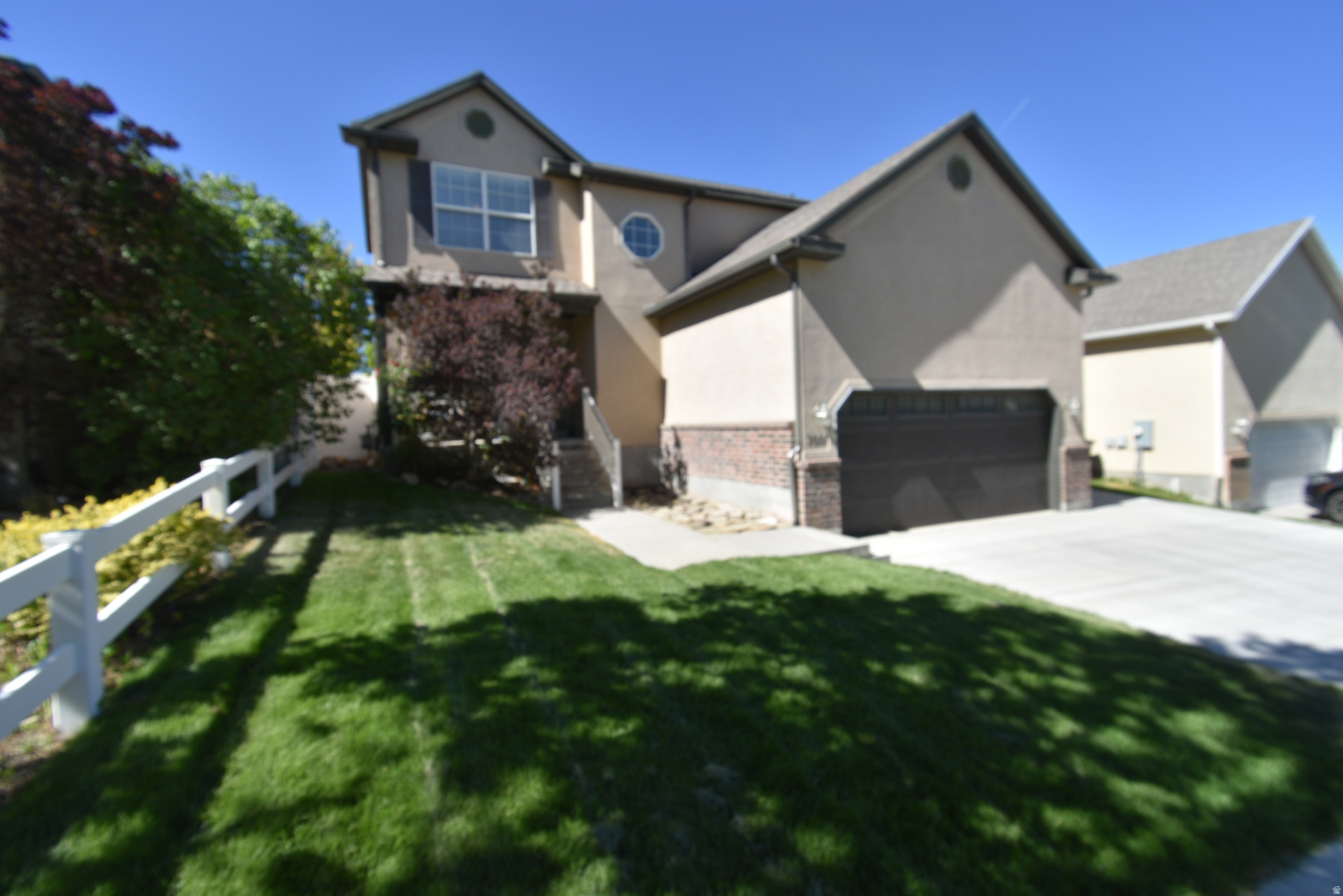 Meticulously Maintained Two-Story Gem in the Heart of West Jordan. Welcome to this stunning, move-in-ready 2-story home that perfectly blends modern updates with functional living space. From the moment you arrive, you'll be impressed by the exceptional curb appeal, featuring a re-landscaped front yard complete with lush new sod and stylish river rocks in the park strip. The property also boasts a rare and highly desirable RV pad, providing ample space for your outdoor toys and additional parking. Step inside to find a light-filled interior that feels brand new, thanks to fresh paint throughout the kitchen, bedrooms, and all four bathrooms. The main floor is designed for both comfort and durability, showcasing beautiful new laminate flooring that flows seamlessly through the living areas. The true standout of this home is the 100% fully finished basement. While many homes in the area offer unfinished lower levels, this property provides immediate value with a completely realized space that includes an additional bedroom, a full bathroom, and a  family room-perfect for guests, a home office,