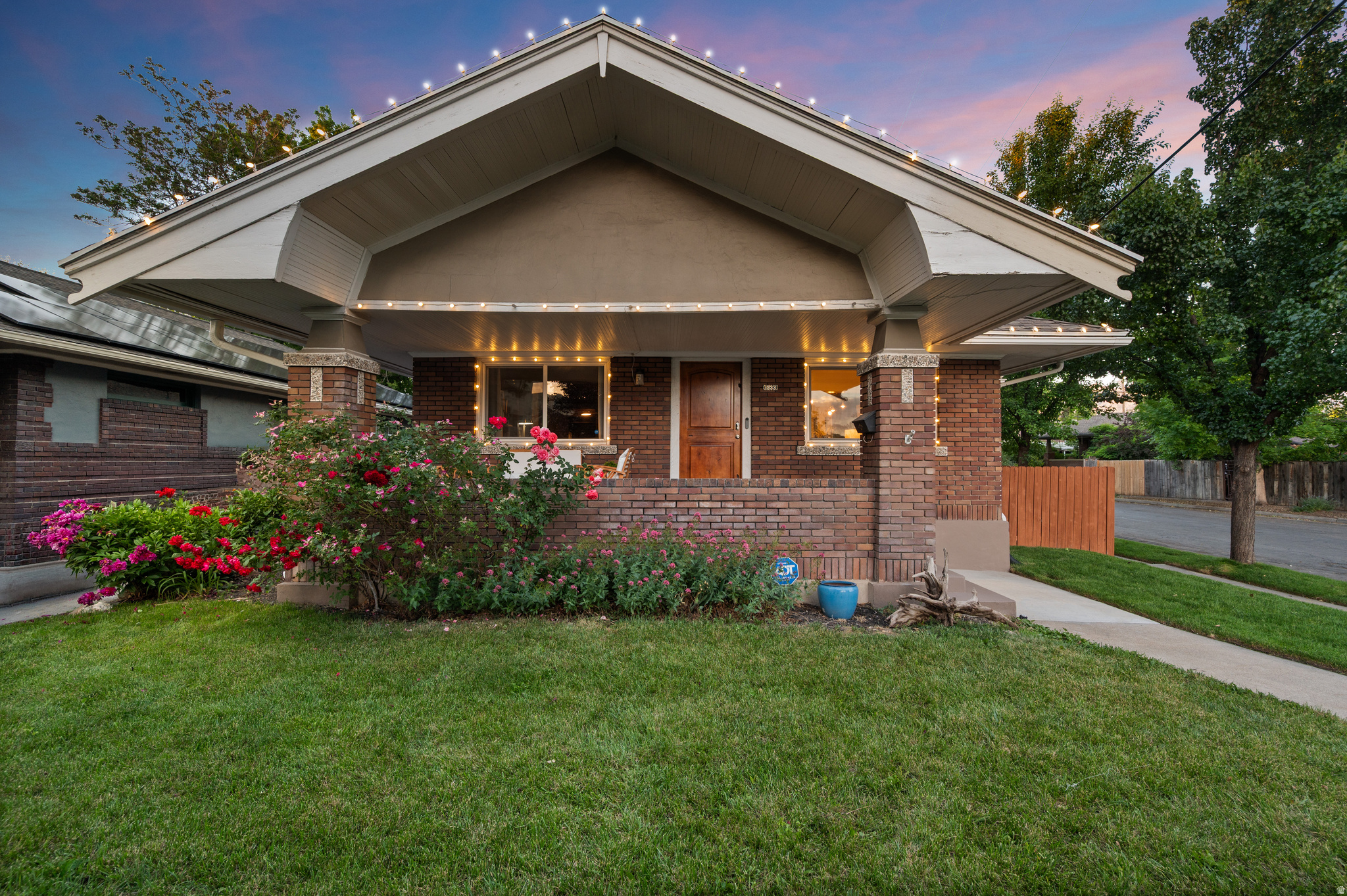VINTAGE MEETS MODERN in this fully updated 1922 bungalow. Recent improvements include updated electrical, foundation piers for added structural stability, and all the pretty finishes: carpet, paint, wallpaper, lighting, hardware, and more. Featuring a rare legal Mother-in-Law apartment (ADU) with separate entrance and convenient access to shared laundry. The open-concept main level showcases a show-stopping dining room made for entertaining, gourmet kitchen with granite countertops, stainless steel appliances, farmhouse sink, custom tile, and flex duo oven, walnut flooring, and the rare advantage of three bedrooms on the main floor, each with its own walk-in closet. The oversized primary suite is a retreat of its own, wrapped in rich tones and featuring a fireplace and sitting area. Outside, the 720-square-foot detached garage parks two vehicles or provides flexible space for a workshop, gym, or studio. Enjoy morning coffee on the front porch as dogs walk their humans by, then retreat to the shaded hammock nook with solar lighting for all-day enjoyment. The perfectly sized backyard offers room to relax without consuming your weekends, while the covered stone patio may have you choosing between hosting or declining plans in favor of staying home. Walk to Trader Joe's, the Sugarhouse S-Line, to Liberty Park, and to any of the dozens of restaurant nearby! Welcome Home! [Agent related to seller and has an interest in the home.]