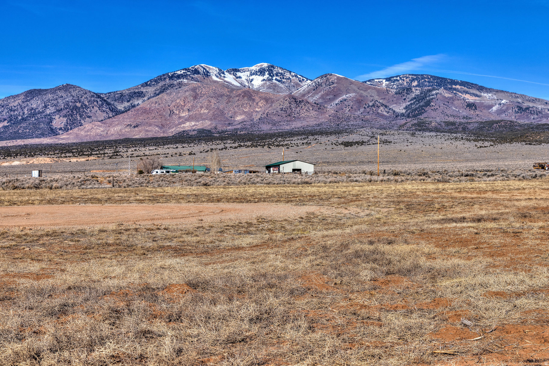 Located in the quiet rural community of La Sal, this 3.98-acre parcel offers a rare opportunity to own a peaceful piece of Utah's high desert, approximately 30 minutes from Moab. The property features expansive views of the surrounding mountains and wide-open landscapes, providing an ideal setting for those seeking privacy, tranquility, and exceptional night skies. Enjoy minimal light pollution and some of the best stargazing the area has to offer. Accessible location with convenient proximity to outdoor recreation and public lands, while maintaining a quiet, rural atmosphere. Buyer will have to install a septic system and drill a well.