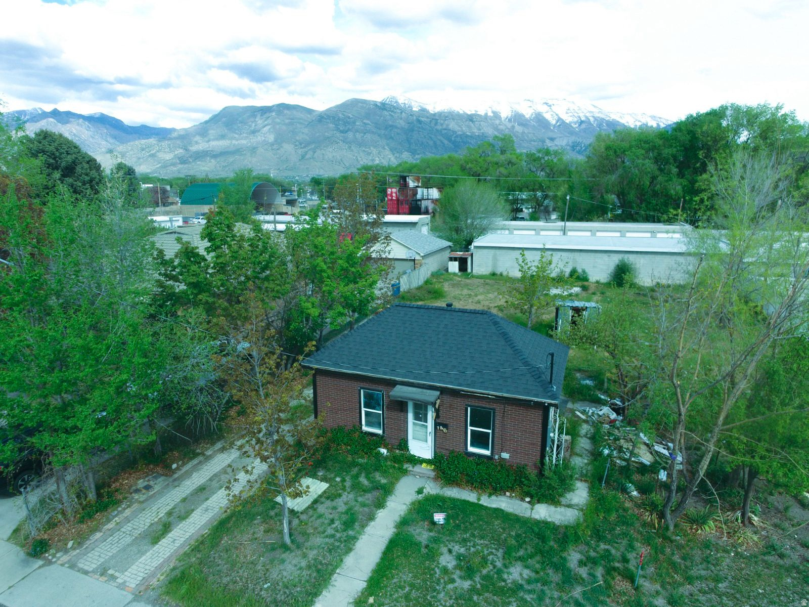 Calling all investors, flippers, and residential buyers seeking land opportunities in American Fork! This .24-acre property features a 570 sq. ft. home that requires a complete remodel, with the roof recently replaced in 2024.  The property offers multiple potential investment strategies depending on your vision: renovate and flip the existing home, convert the current structure into an ADU while building a new primary residence behind it, or remove the existing home and develop a brand-new build from the ground up.  Seller financing is available, creating additional flexibility for qualified buyers. This is a rare opportunity in a rapidly growing area with strong future potential.  Buyer to verify all zoning regulations, permitted uses, building setbacks, and development possibilities directly with American Fork. Please contact the listing agent before walking the property.