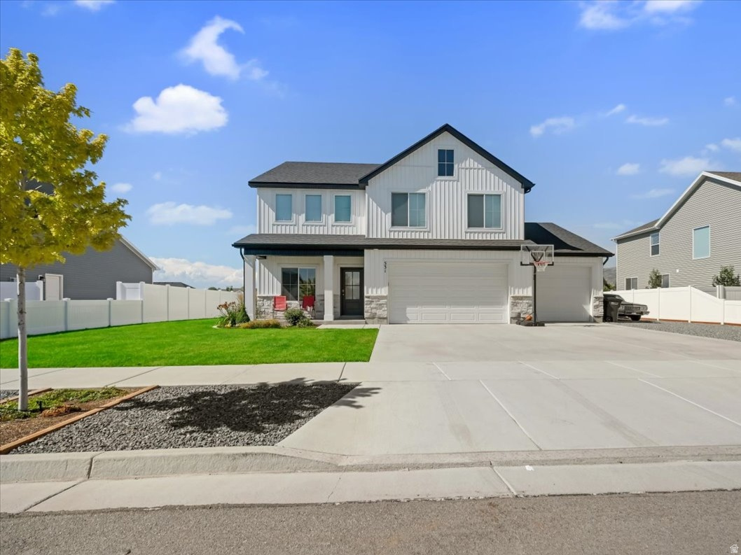 Newly Fenced yard! Built in 2022, this clean south facing 2-story in the Rolling Hills subdivision offers 4 bedrooms, 2.5 bathrooms, two living areas, and a dedicated office for flexible living. The open layout provides great flow for daily living and entertaining, while the oversized 4-car garage and RV parking offer ample space for vehicles, storage, and toys. Situated on a spacious .36-acre lot, the property features a large partially fenced yard and an extra-large patio ideal for outdoor gatherings. A rare combination of newer construction, functional space, and room to grow.