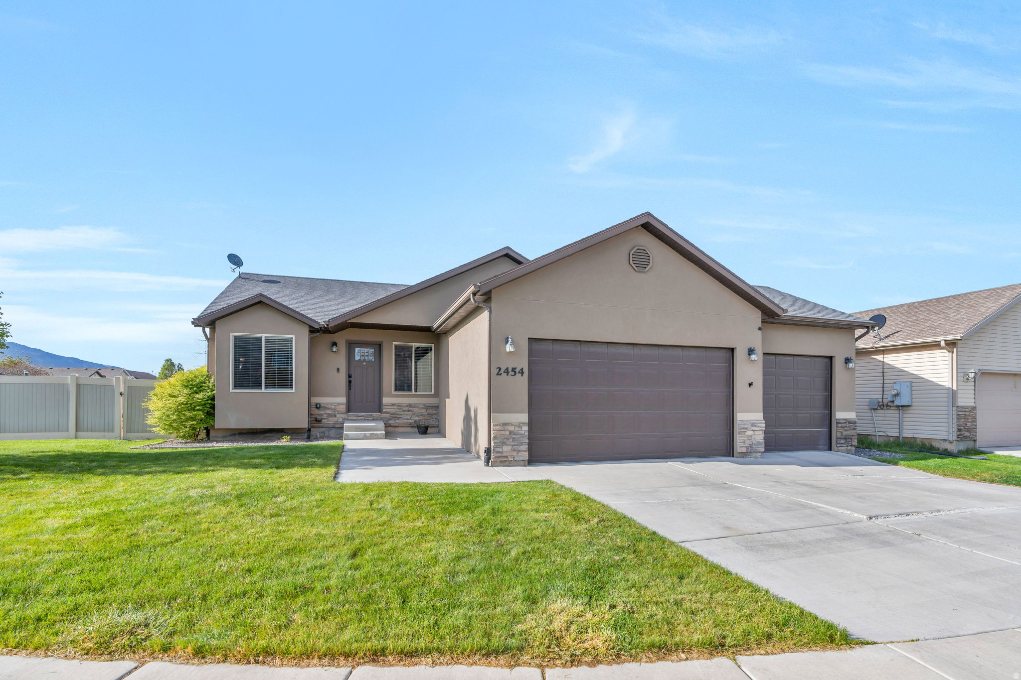 Beautifully maintained rambler on a corner lot in a peaceful Eagle Mountain neighborhood. The living area features vaulted ceilings and flows seamlessly into the kitchen, which offers wood cabinetry, granite countertops, and an island providing additional seating. French doors off the dining area open to the backyard, filling the space with natural light. The primary bedroom includes an ensuite bathroom with dual sinks and a separate tub and shower. Downstairs, the fully finished basement is built for entertaining, featuring a large living area, a stylish kitchenette, plus two additional bedrooms, a full bathroom, and cold storage. Outside, the fully fenced backyard offers a large covered patio, an RV pad, and mountain views. The 3-car garage includes epoxy flooring. Additional highlights include a water softener, new water heater, smart thermostat, video doorbell, and fiber internet. Conveniently located near Cory B. Wride Park, hiking and ATV trails, Macy's grocery, Dutch Bros, Costa Vida, and the Eagle Mountain Marketplace. Measurements provided as a courtesy only, buyer to verify all info.