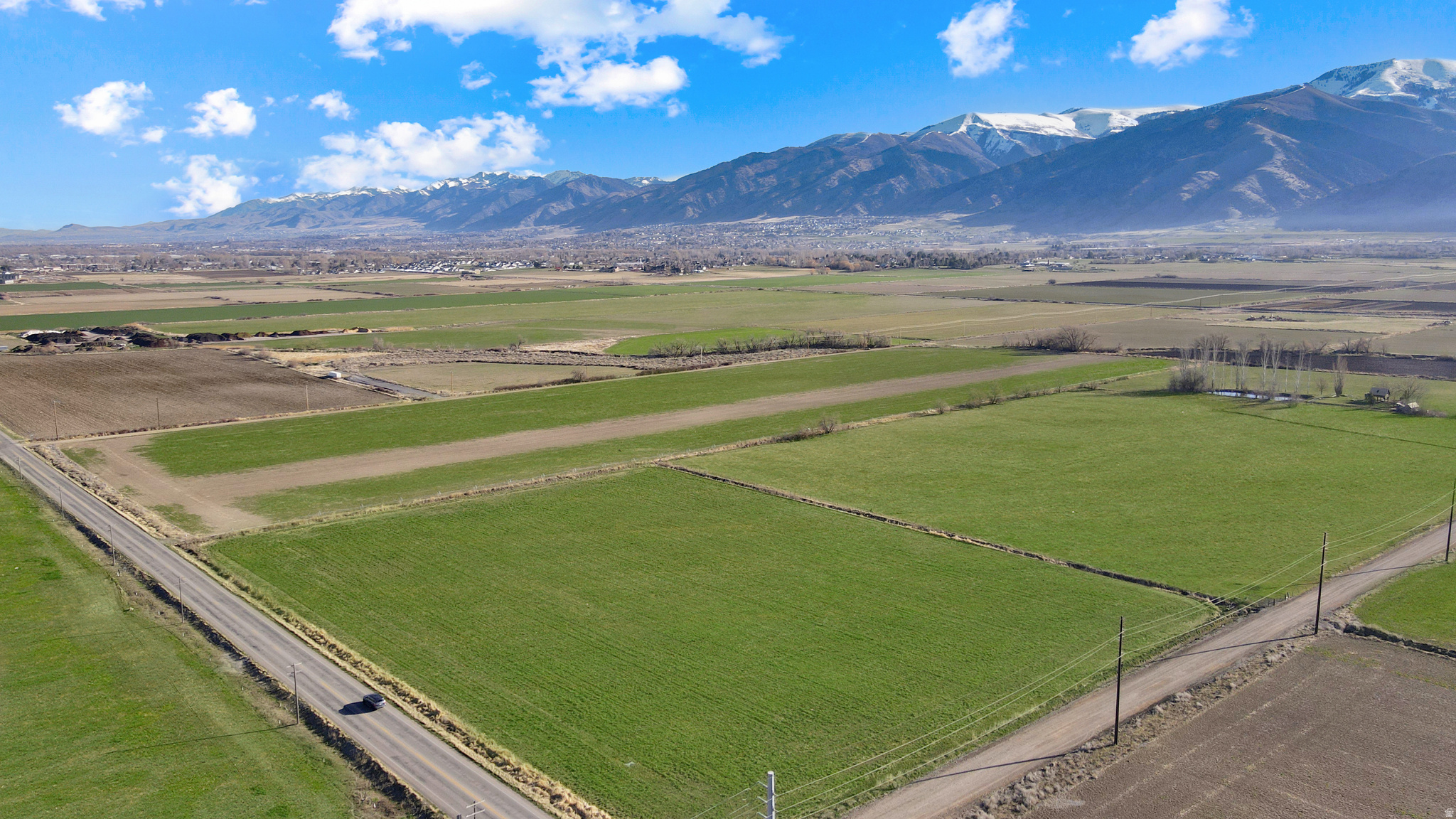 Opportunity to own 32.4 acres in a rapidly growing area of Hyrum with strong potential for future industrial use. Located near JBS Swift and other established industrial operations, this property offers excellent positioning for investors, developers, or end users looking to secure land in a high-demand corridor.  Currently zoned agricultural, the property presents a valuable opportunity for potential rezoning to industrial. Flat, usable ground with convenient access and close proximity to major transportation routes enhances its long-term value and versatility.  Irrigation shares are available for purchase, adding flexibility for continued agricultural use or future planning.  Whether you're looking to hold as an investment, develop, or expand your operation, this property offers location, scale, and opportunity.
