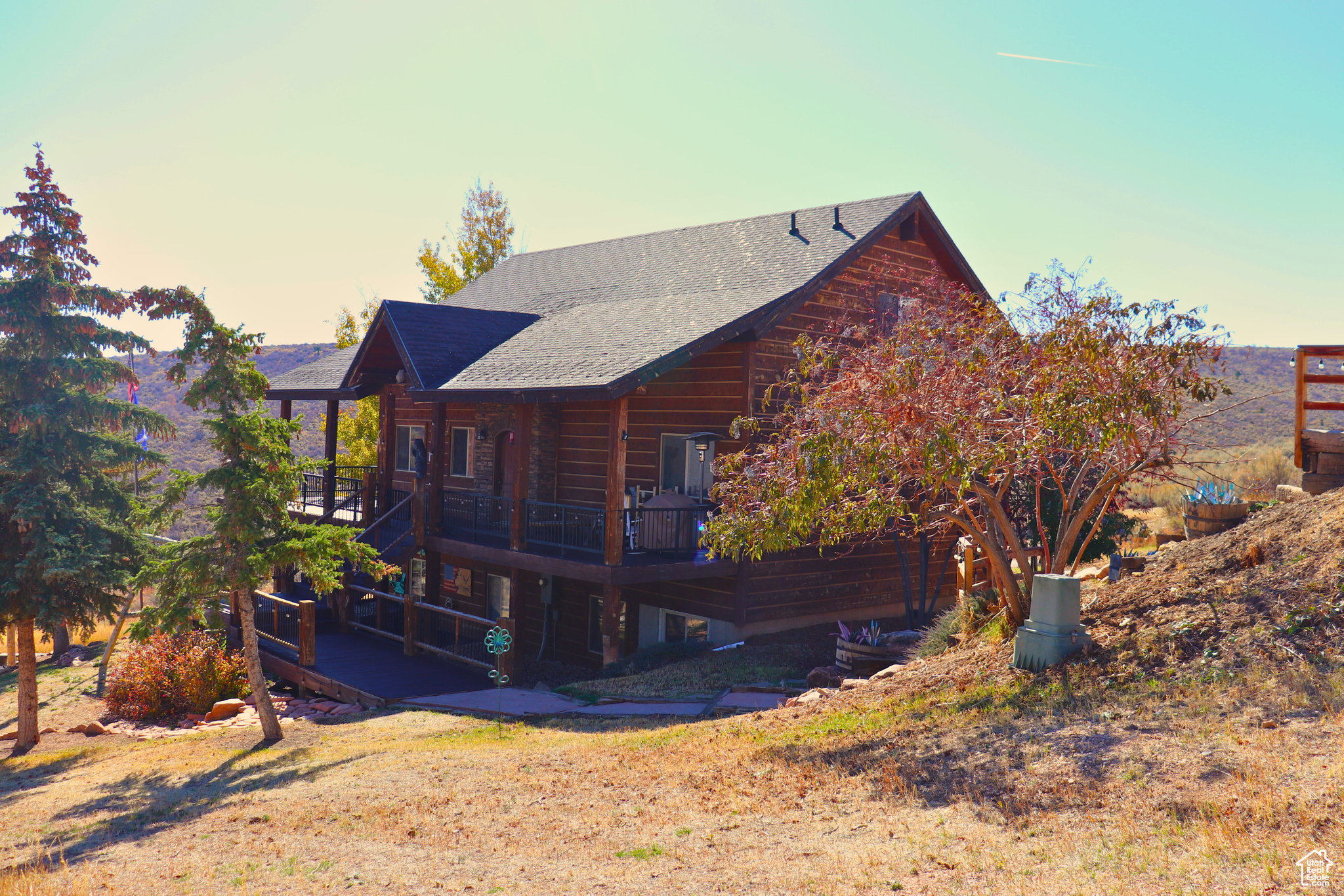YEAR ROUND LIVING or the perfect getaway with beautiful views of Bear Lake.  This home is already a successful Airbnb.  The home features a large deck with stunning views, covered patio, 2 car garage, storage sheds, fire pit and swings. That is just the outside.  Inside features 5 bedrooms, 3 baths, amazing kitchen great room with ample windows that bring in the amazing landscape and natural light. Home has a rustic feel with all the newer comforts of home.  HOA takes care of road maintenance and snow removal for year round access.