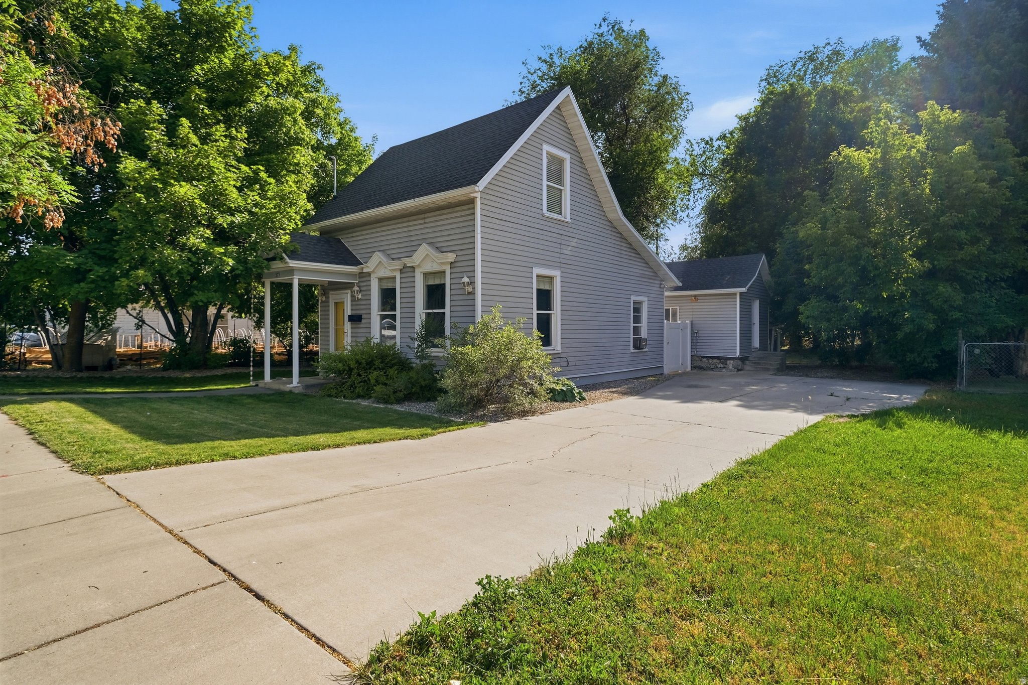Absolutely adorable and move-in ready! This charming 2-story Logan home is packed with character and all the big-ticket updates buyers love, including a brand-new roof in 2025, updated kitchen with granite countertops, remodeled bath, newer appliances, lighting, gorgeous hardwood floors, and the refrigerator, washer, and dryer are included! Cozy up by the fireplace, relax under the covered patio, and enjoy the huge backyard with mature shade trees, automatic sprinklers, and plenty of room for kids, pets, and entertaining. Upstairs offers a bedroom, flex space, and half bath, while the detached casita with power and storage below provides endless possibilities-office, gym, hobby room, guest space, or studio! Cute, affordable, and full of personality-this one checks all the boxes and is a must-see! Don't forget to check the 3D tour and Video tour out! Buyer to verify all information.