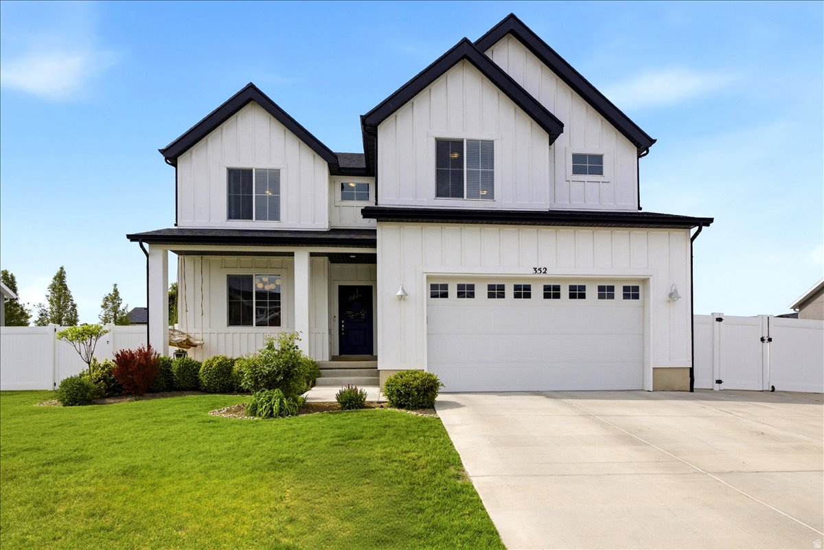 BACK ON THE MARKET! Step into timeless charm and comfort in this farmhouse-style home. The main level blends warmth and functionality, highlighted by a family room with a cast-stone fireplace and a beautifully appointed kitchen featuring quartz countertops, gas cooktop, 42" white cabinetry, and a spacious walk-in pantry. The 4' wide staircase leads upstairs to the primary suite with a recently remodeled bath, Euro glass shower, freestanding tub, and walk-in closet. Two additional bedrooms, a full bath, an upstairs laundry, and a playroom/flex space. The unfinished lower level offers an opportunity for future expansion. Situated on a large lot with RV parking in a desirable neighborhood, this home offers space, privacy, and convenience-just minutes from shopping, dining, schools, freeway access, and everyday essentials.