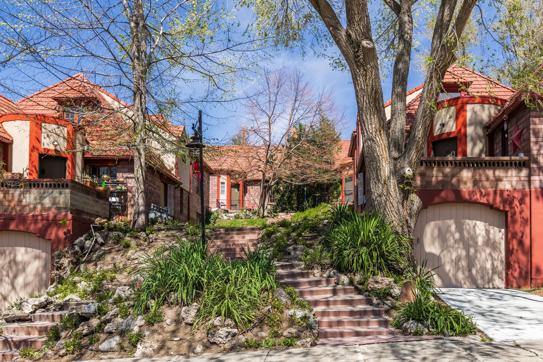 This rare multi-family offering consists of three standalone duplexes creating six individual residential units, ideally located on Capitol Hill bordering downtown, the State Capitol, and the Avenues in one of Salt Lake City's most desirable and enduring neighborhoods. Positioned just above North Temple, the property provides exceptional accessibility to the University of Utah, the vibrant urban corridor, the airport, and the surrounding canyons, while maintaining a sense of privacy set back from the city center. The unique configuration creates a residential environment where each unit lives more like an individual home, with private entryways framed by distinctive turret-style architectural elements. Rich in character, the residences feature original hardwood floors, fireplaces, curved doorways, and colorful vintage tile, elements that have contributed to long-term tenant retention and a strong sense of place. The unit mix includes two one-bedroom, two two-bedroom, and two three-bedroom residences, each with one bathroom and thoughtful layouts. Several units offer additional flexibility with den or dining spaces, along with private balconies capturing views of downtown and the surrounding mountain ranges. A central courtyard provides a shared outdoor gathering space, complemented by covered parking for each unit, shared laundry, and additional storage. While currently capturing below market rents, this property attracts consistent loyalty with many tenants in place for extended periods, some for over two decades, a firm reflection of both the appeal of the property and the stability it offers. While the property has been maintained over time, it presents a clear opportunity for a future owner to thoughtfully update and reposition the asset, aligning rents more closely with current market levels while preserving its architectural integrity. A compelling opportunity to acquire a legacy property with strong fundamentals, irreplaceable character, and meaningful long-term upside in one of Salt Lake City's most sought-after locations.